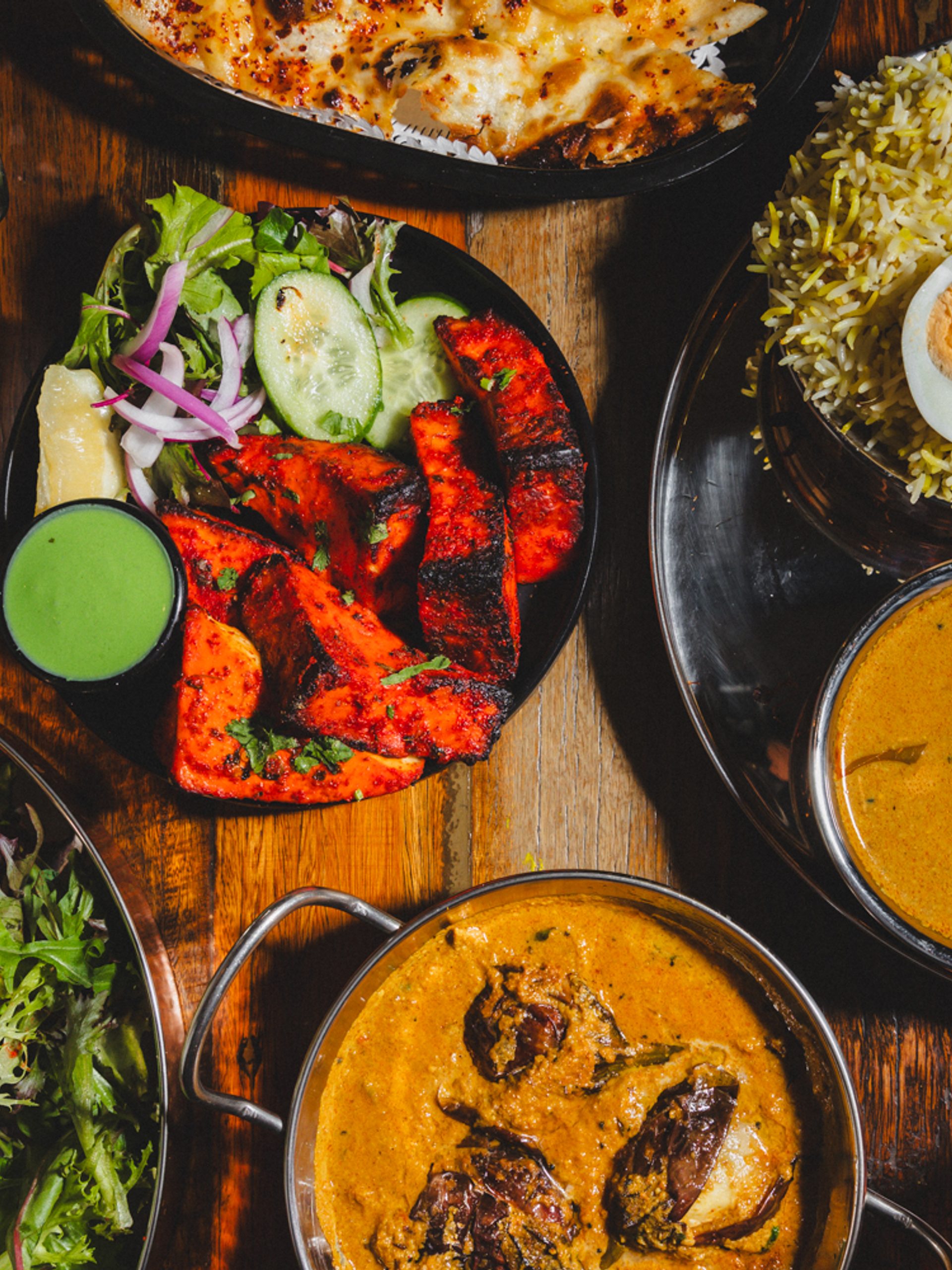 Table filled with plates of food.