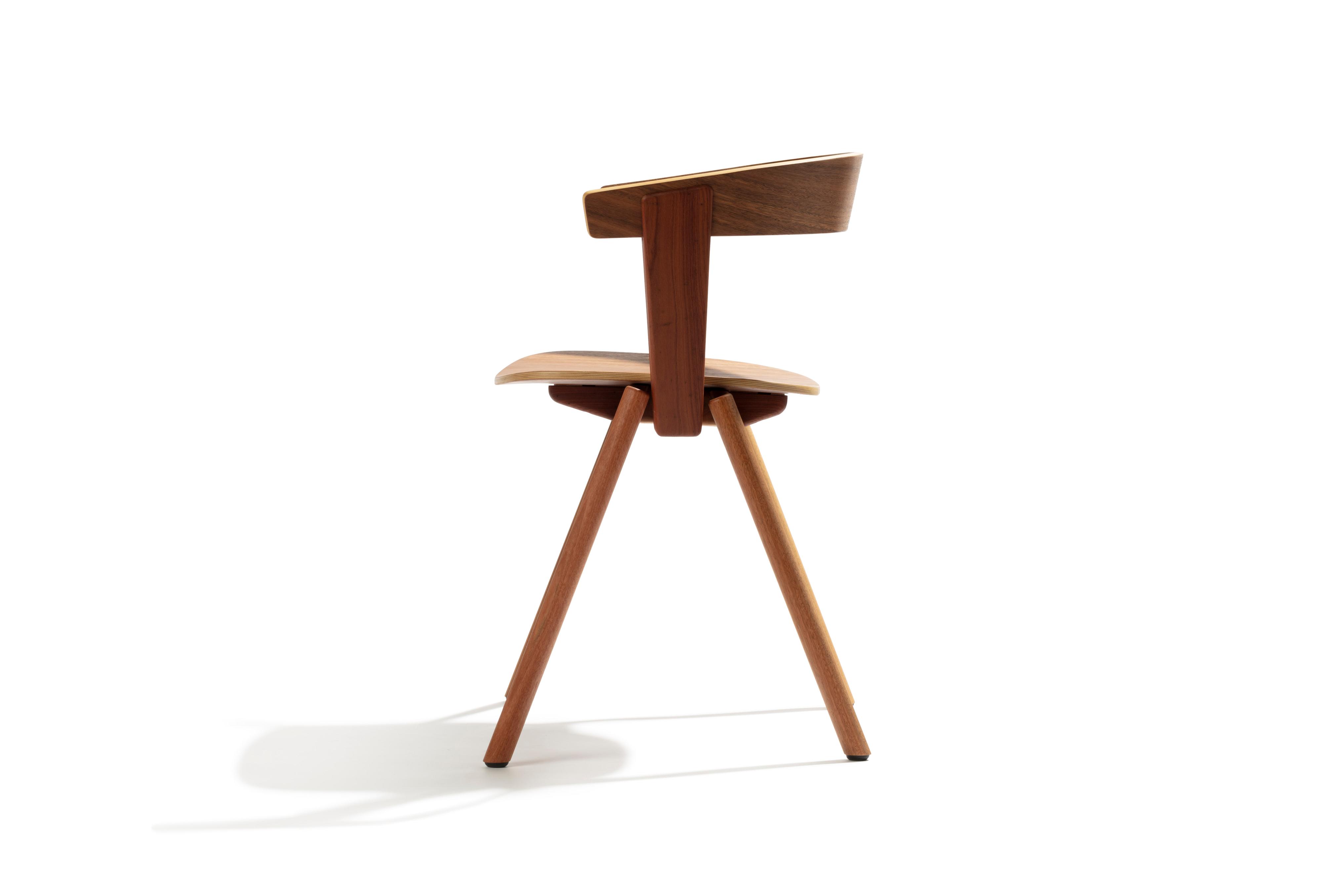 Side preview of a wooden chair with angled legs.