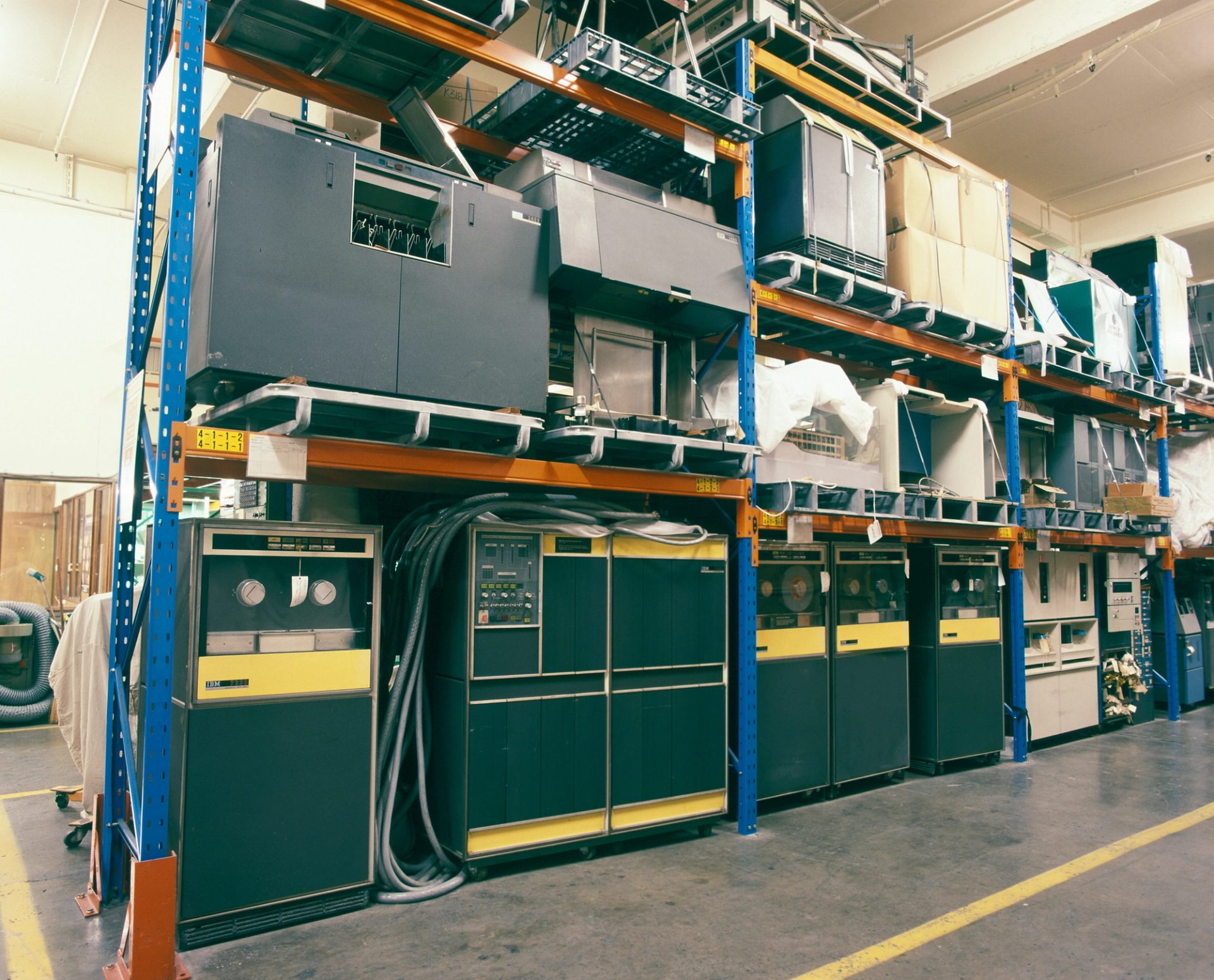 Colour photograph of vintage computer equipment in storage shelving