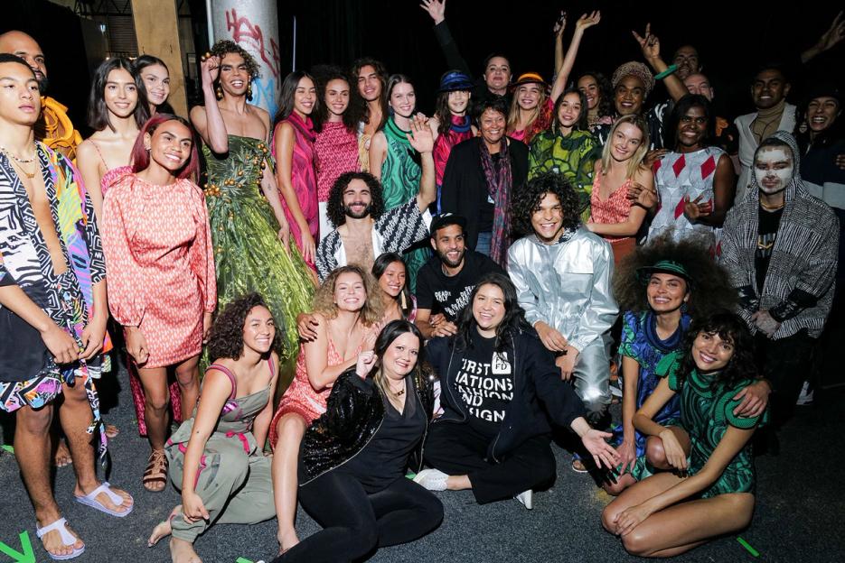 A large group of Indigenous models backstage at fashion week
