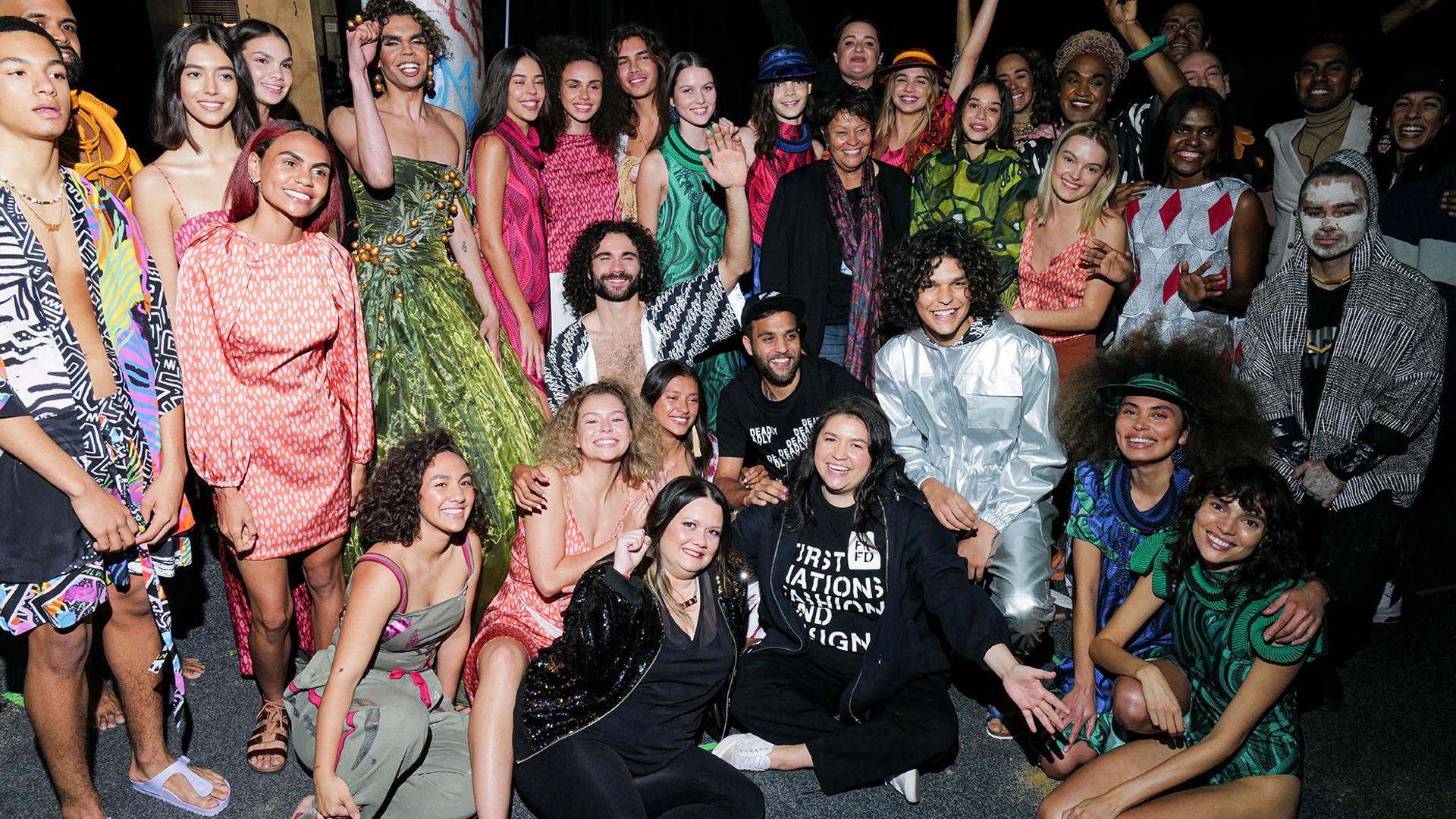 A large group of Indigenous models backstage at fashion week