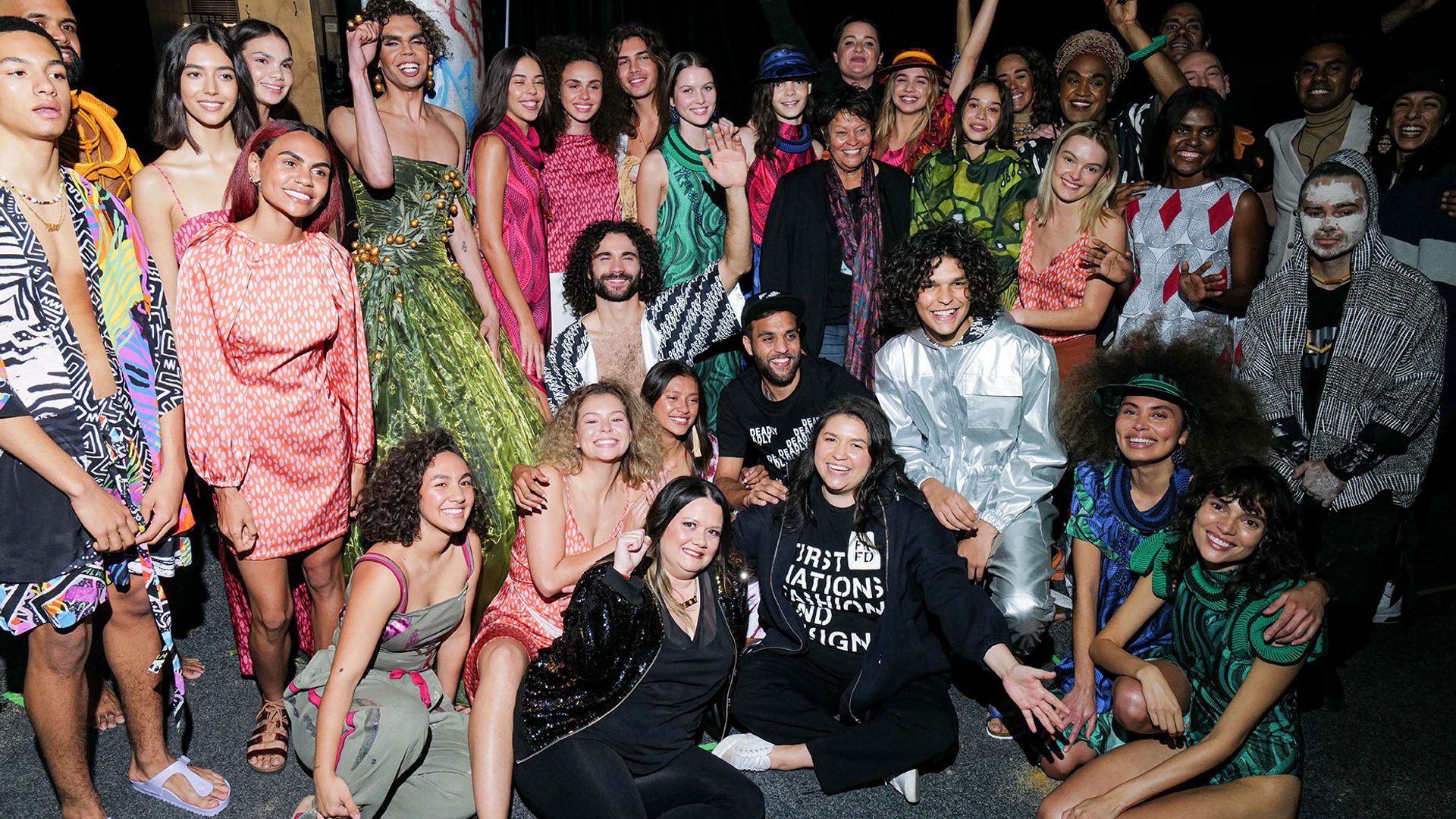 A large group of Indigenous models backstage at fashion week