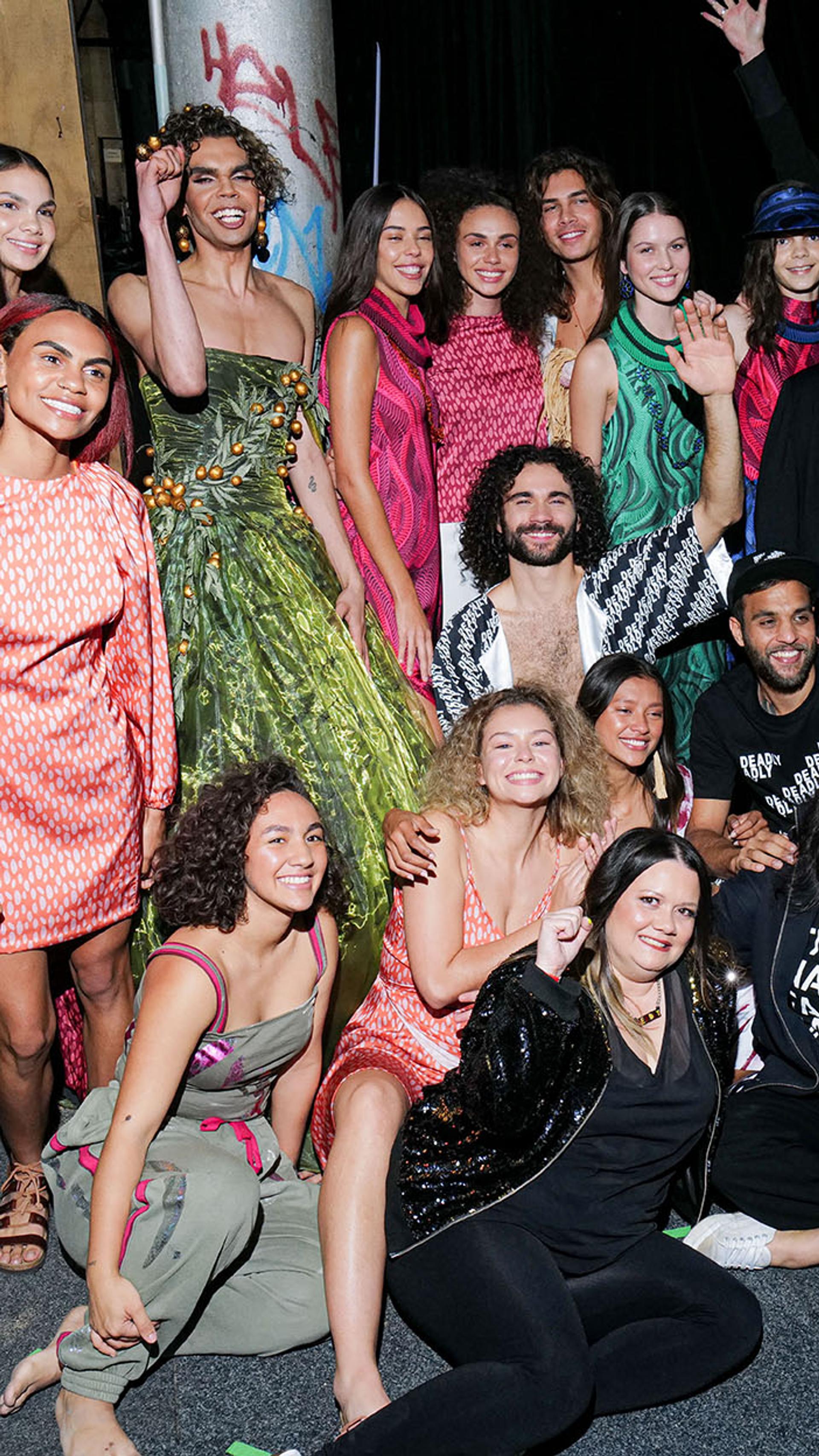 A large group of Indigenous models backstage at fashion week