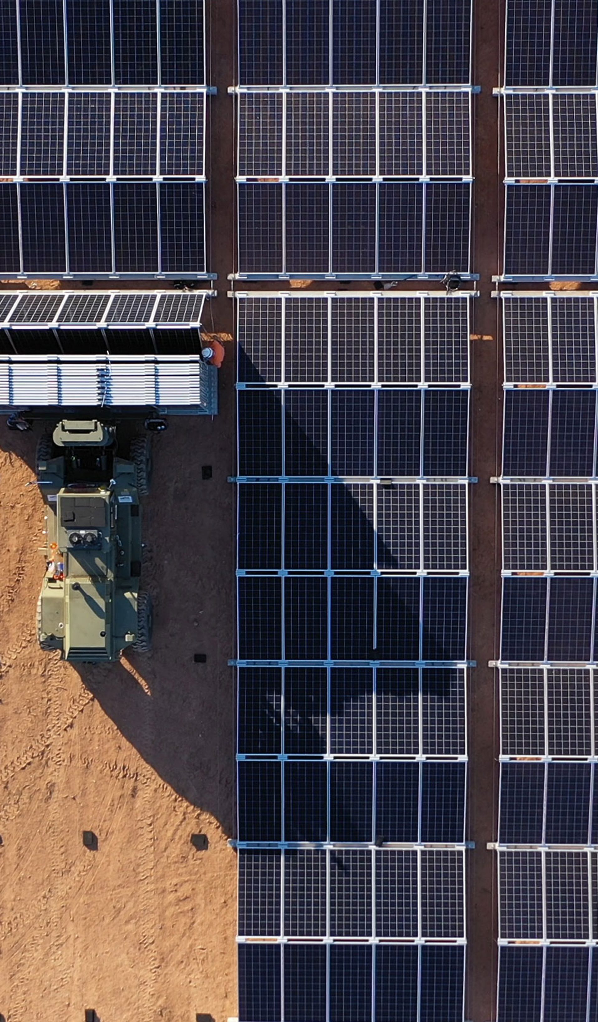solar panels rollout by a tractor on dirt