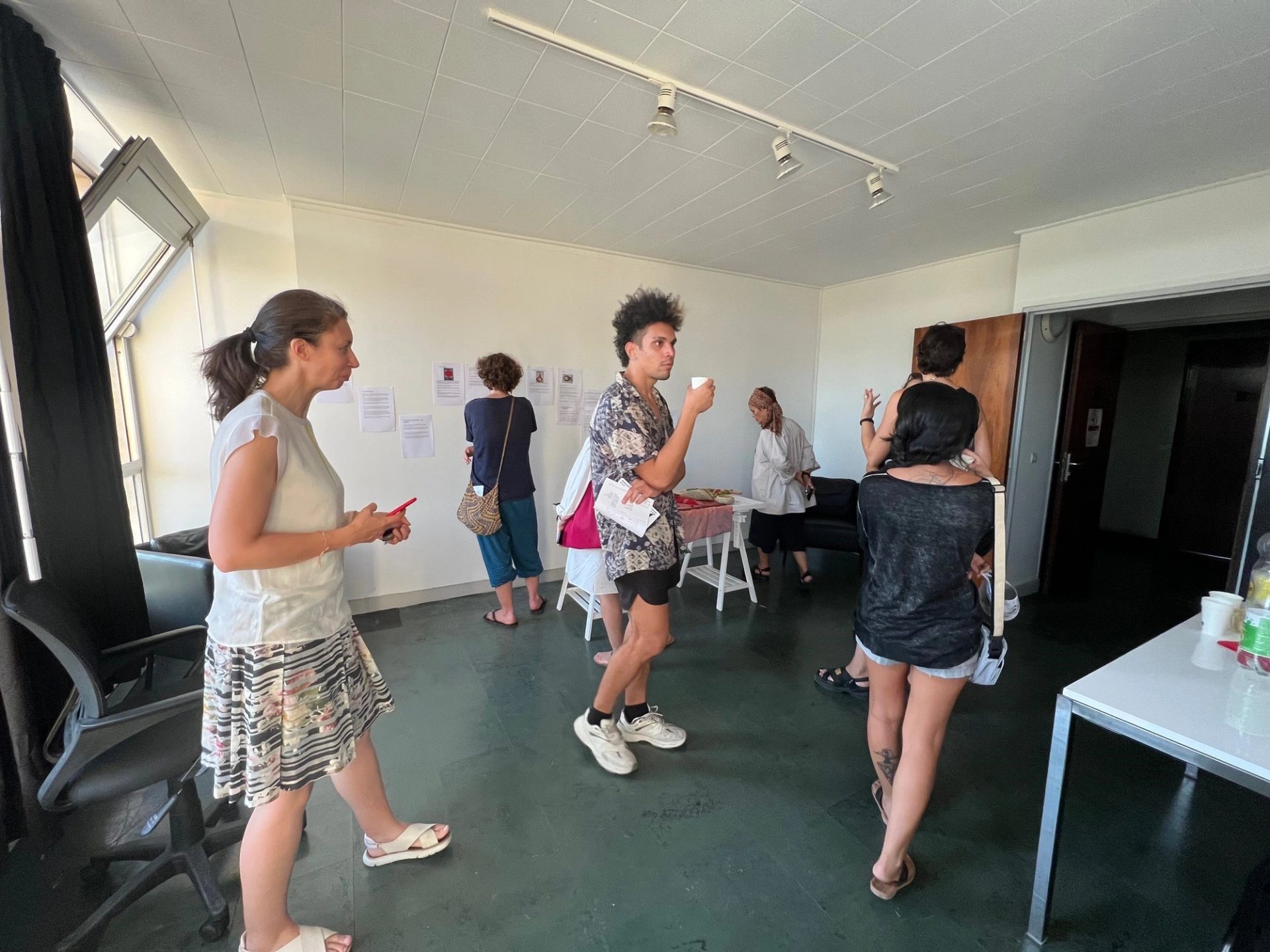 People walking within a room.