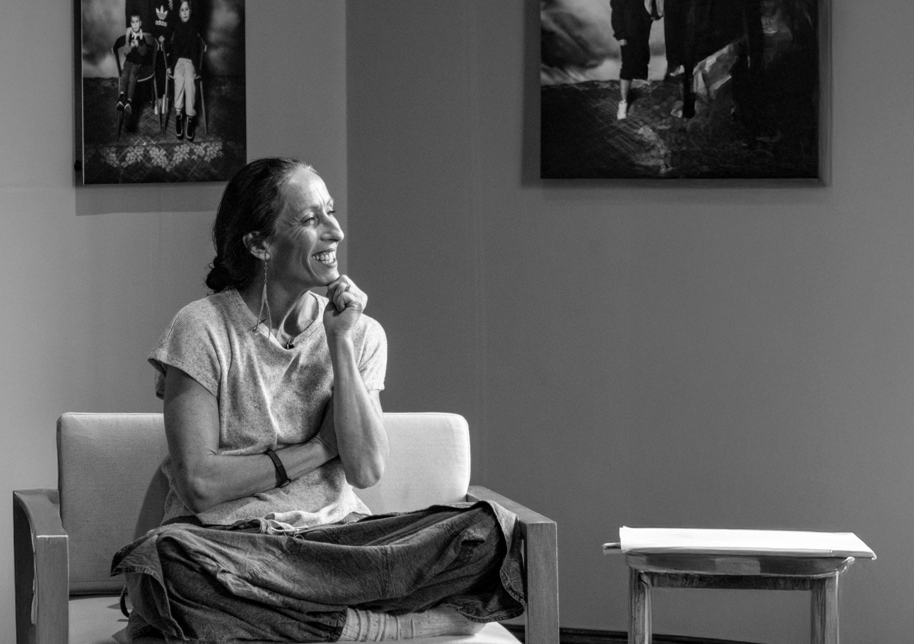 A Muruwarri Wiradjuri woman sits and listens to a conversation.