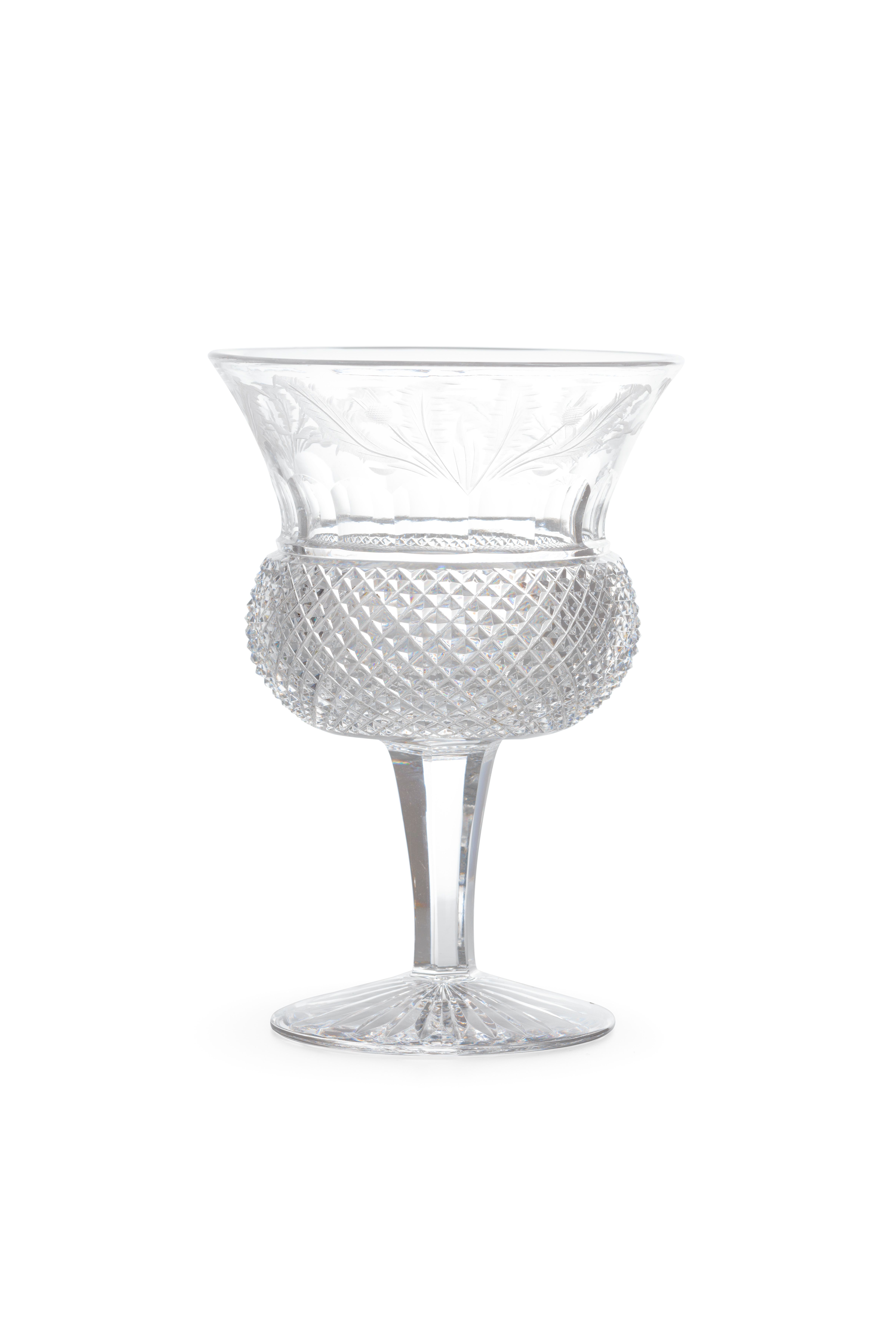 An etched and diamond cut crystal wine glass.