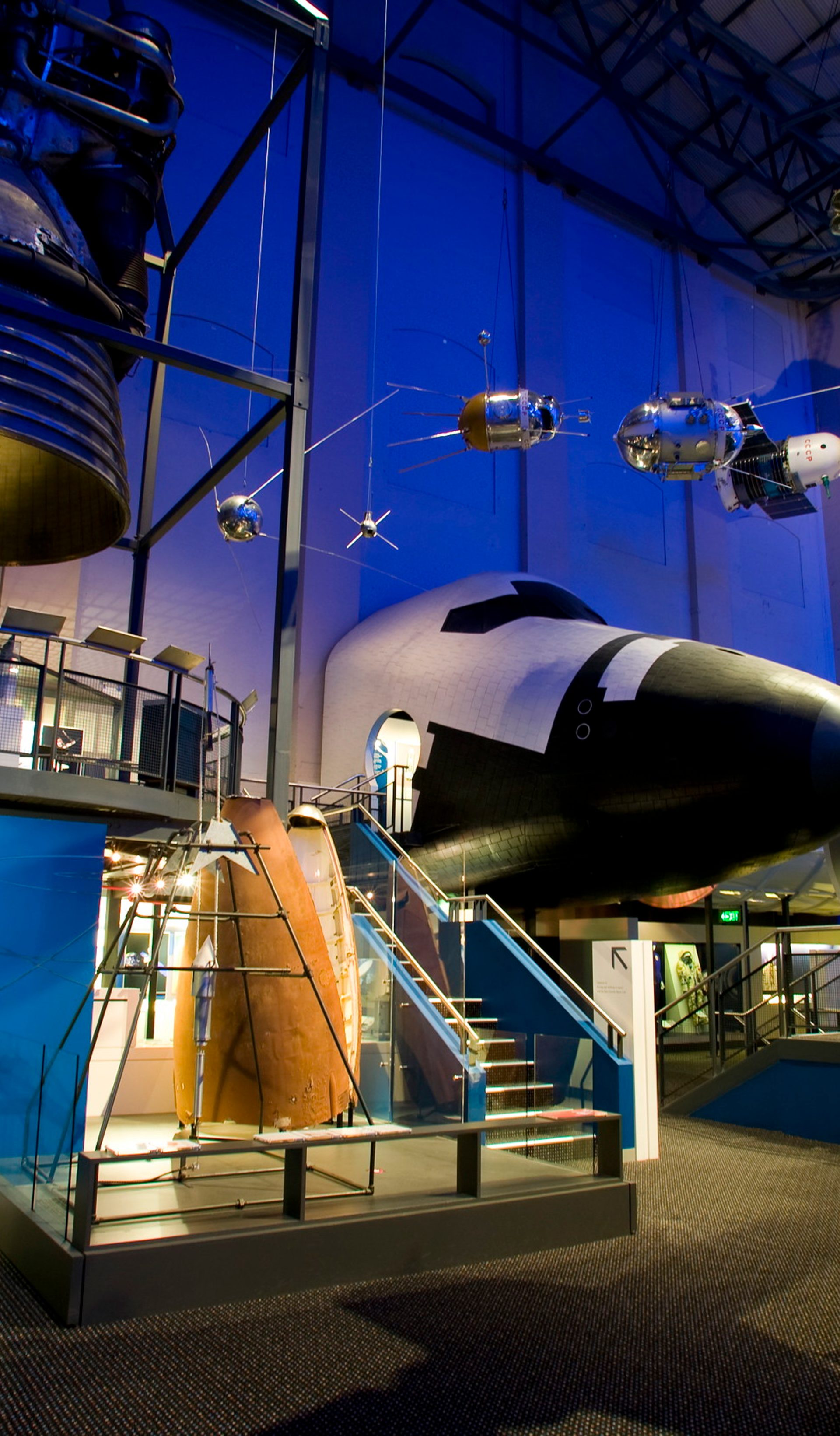 A large exhibition space featuring various large spacecrafts.
