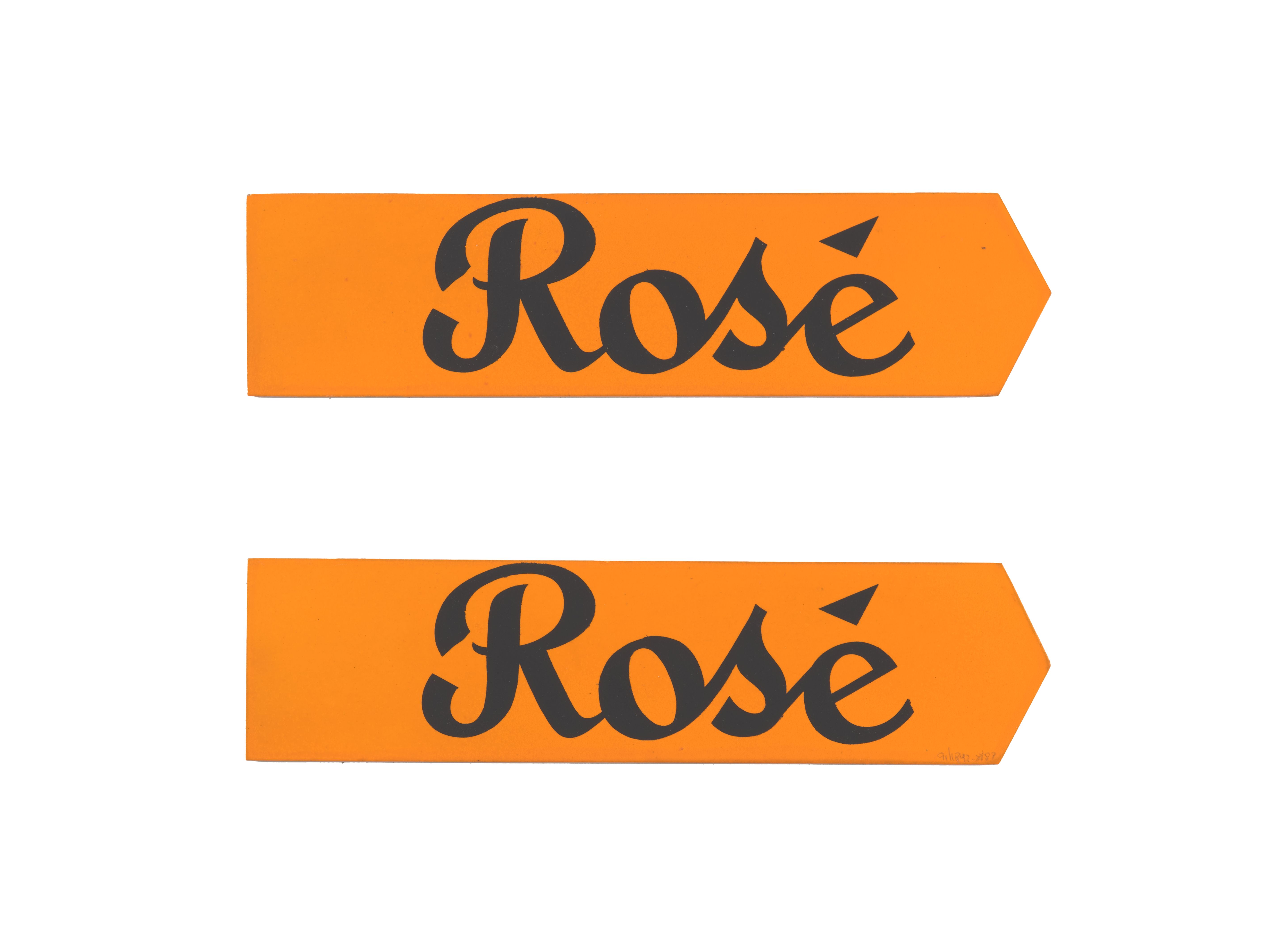 Two signs made of orange paper with the text ‘Rosè’