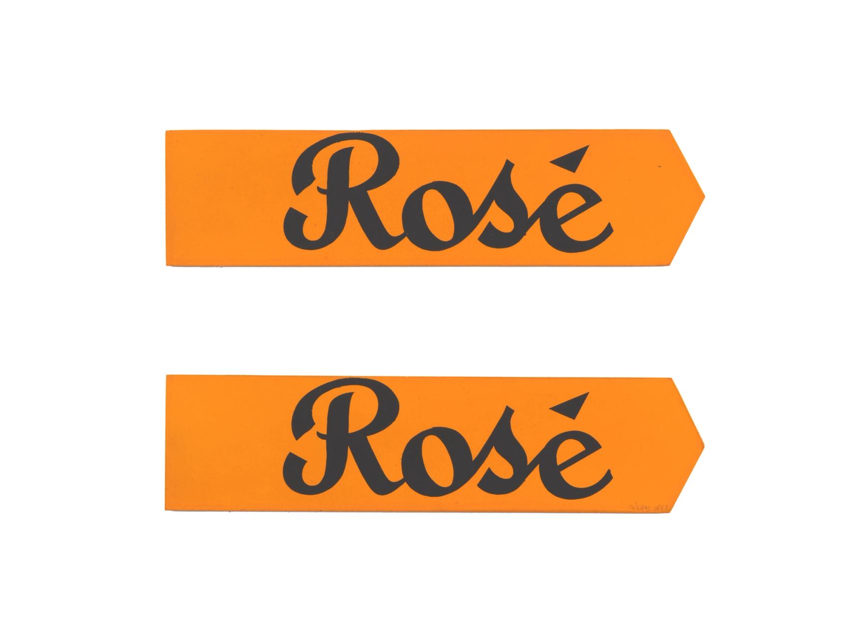 Two signs made of orange paper with the text ‘Rosè’