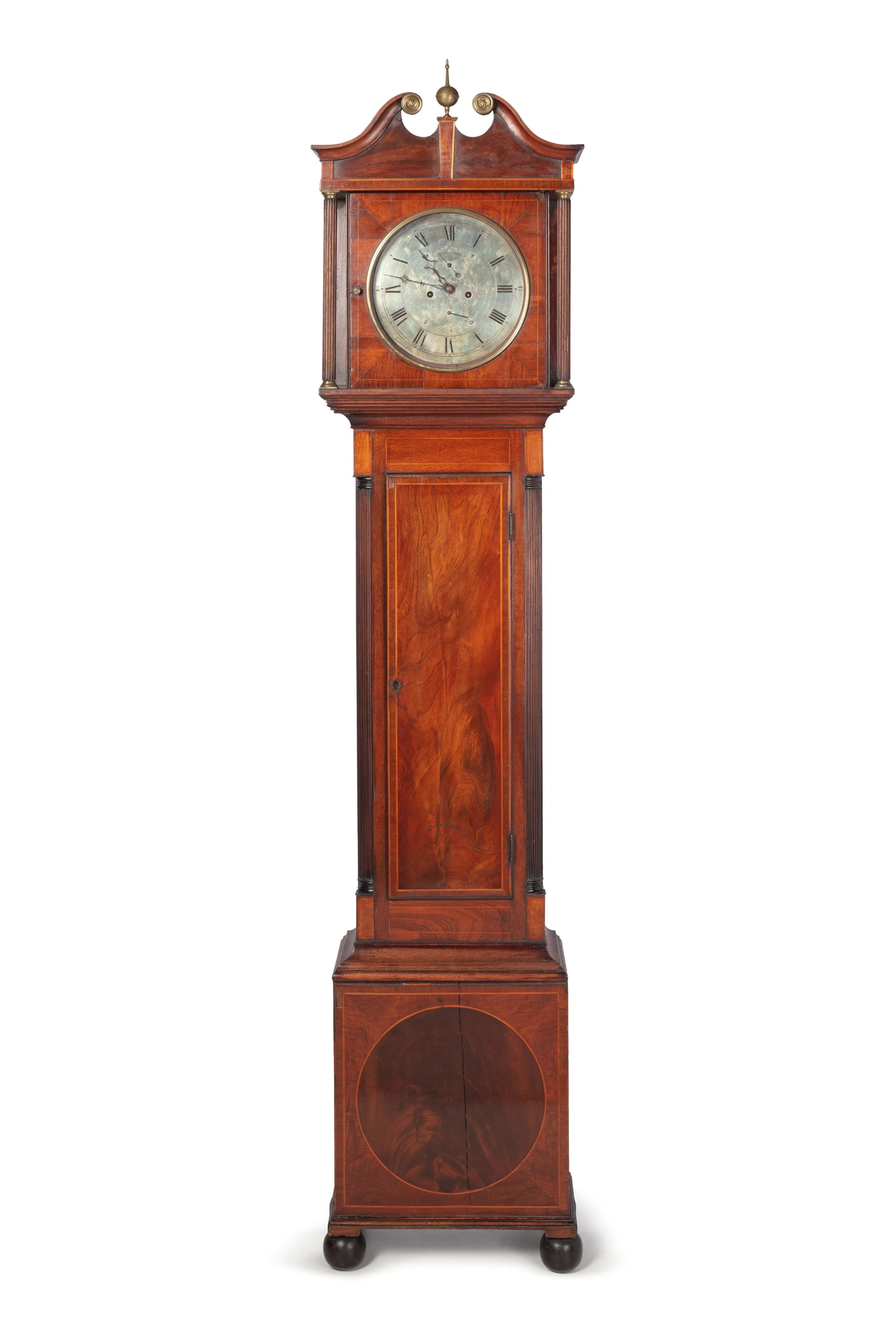 Long case clock made out of wood.