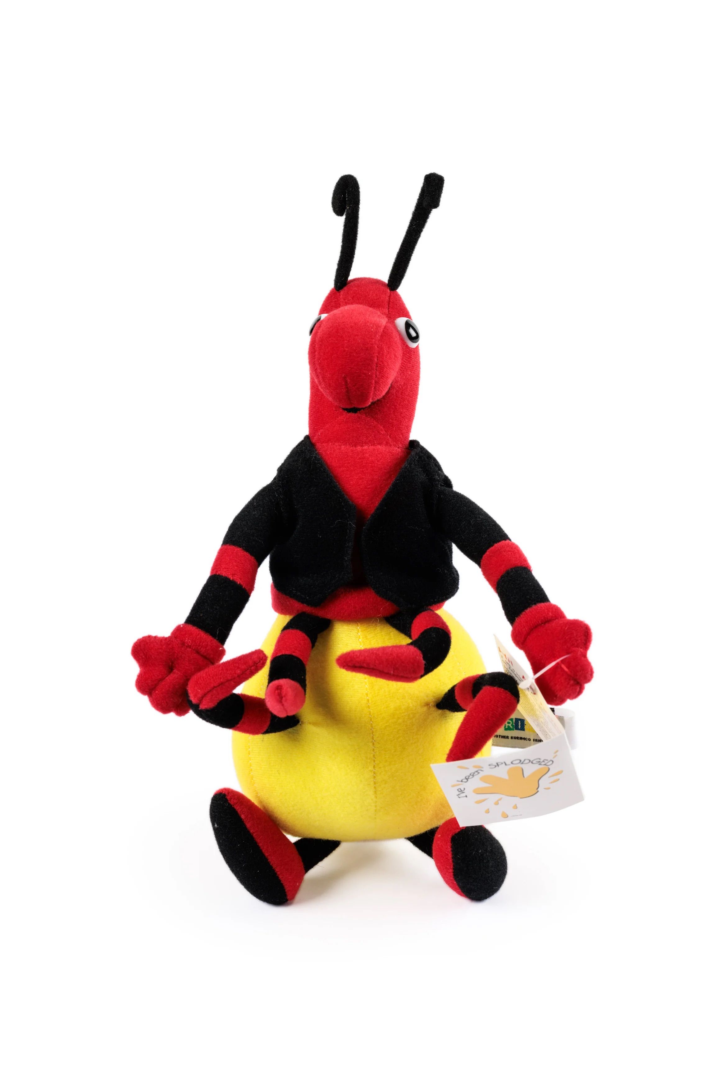 A honey ant soft toy with a yellow rounded lower body, a red upper body and eight red and black striped legs. The ant wears a sleeveless black jacket.