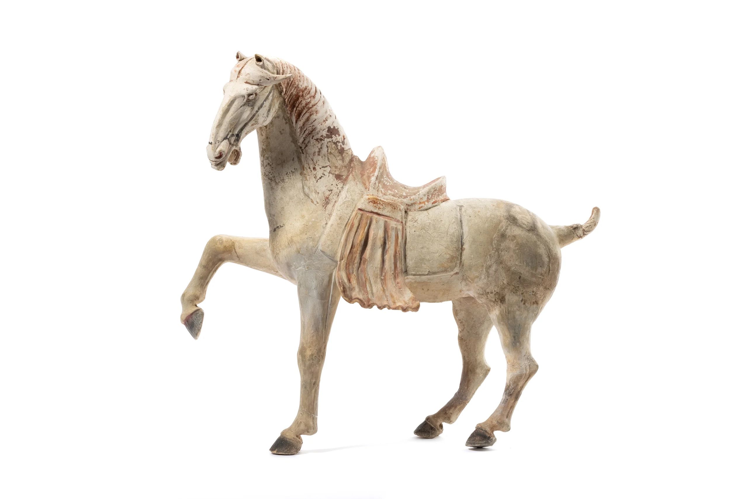 White, ceramic horse with one front leg up and mouth open.