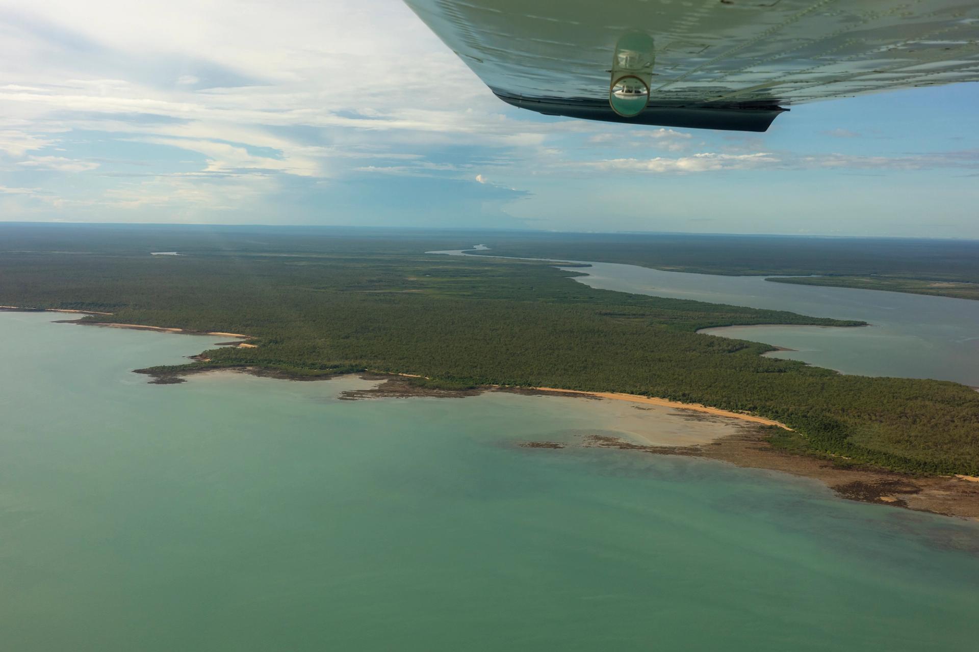An aerial view of Laŋarra taken from the window of a small passenger plane.