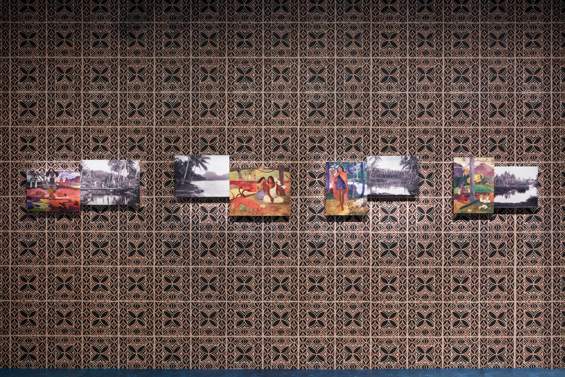 Four prints of paintings by Paul Gauguin.