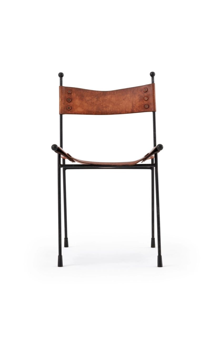 A leather chair with welded and bent steel rod legs, and a seat and backrest made from leather.