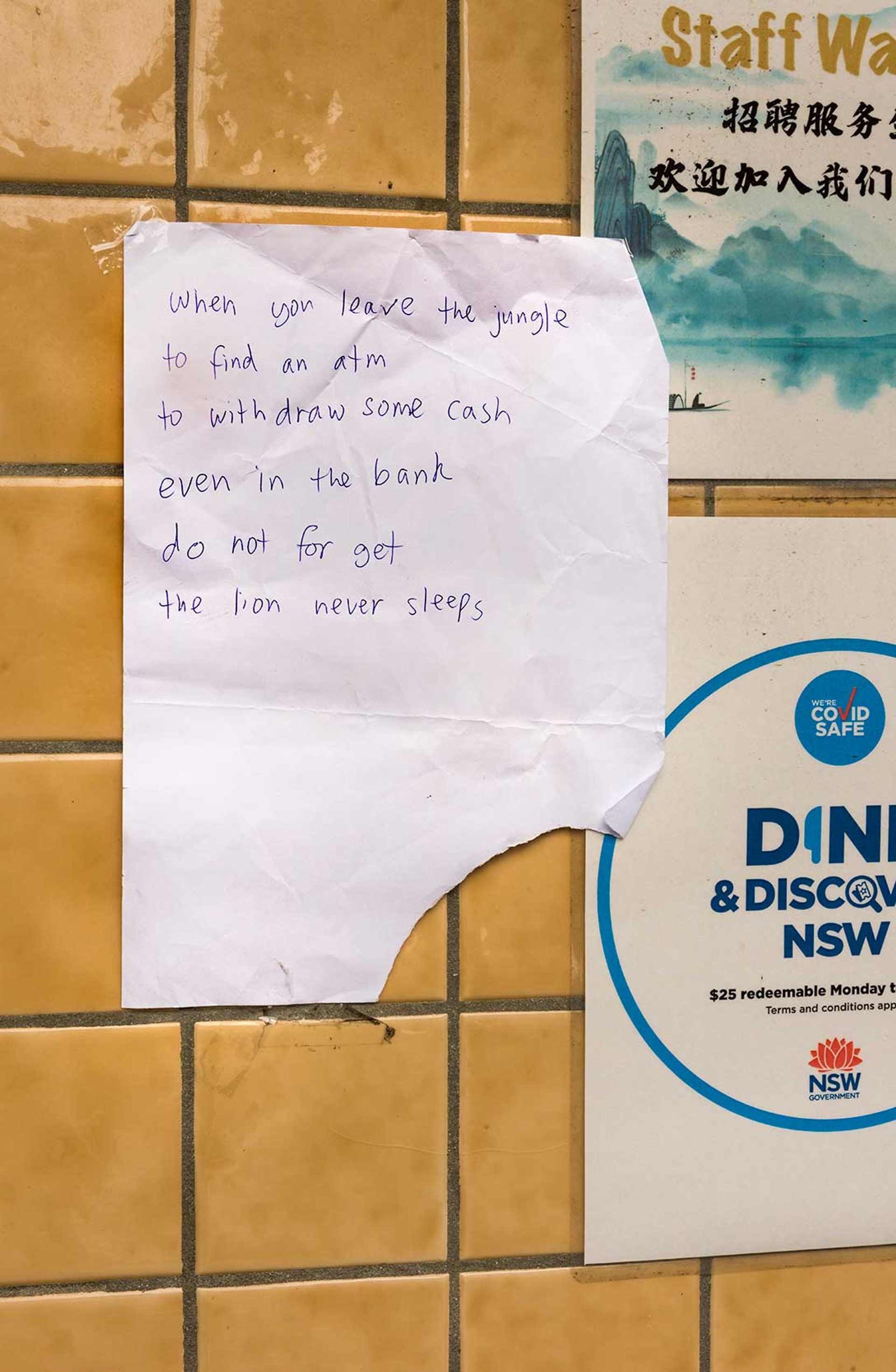 Note reading “WHEN YOU LEAVE THE JUNGLE TO FIND AN ATM TO WITHDRAW SOME CASH EVEN IN THE BANK DO NOT FORGET THE LION NEVER SLEEPS”