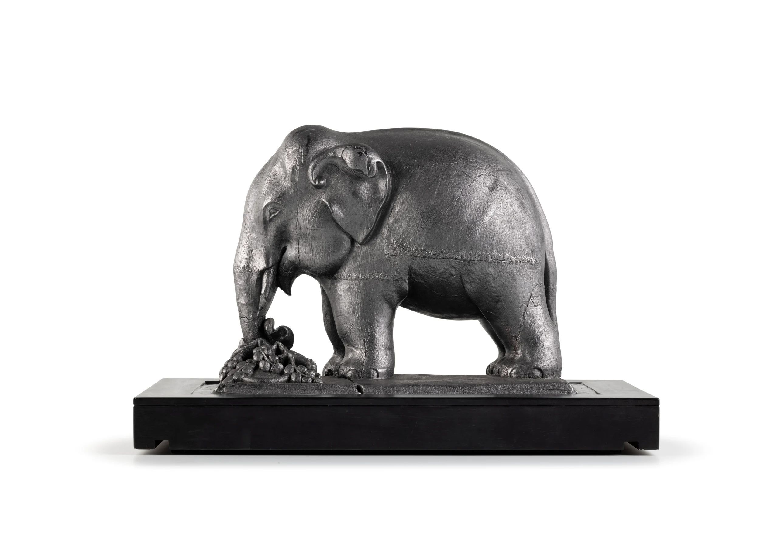 Metallic statue of an elephant.