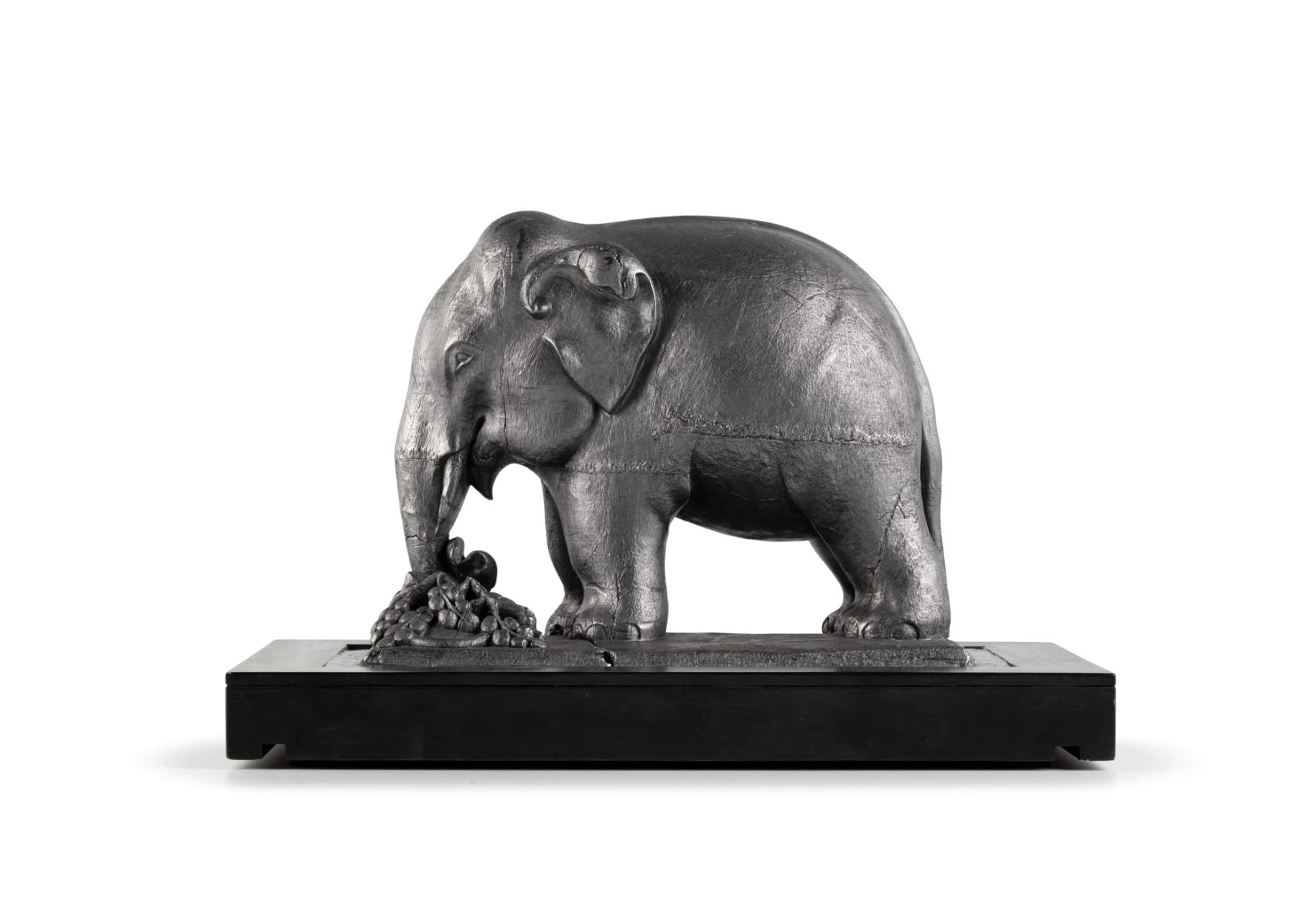 Metallic statue of an elephant.