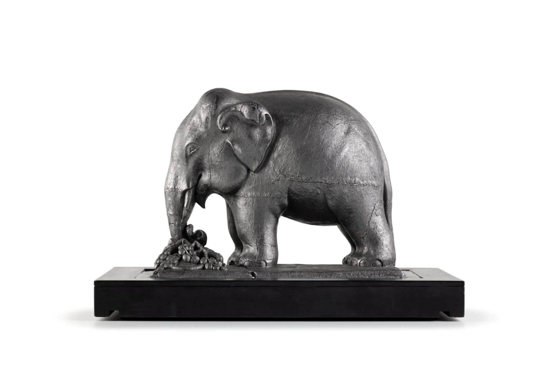 Metallic statue of an elephant.