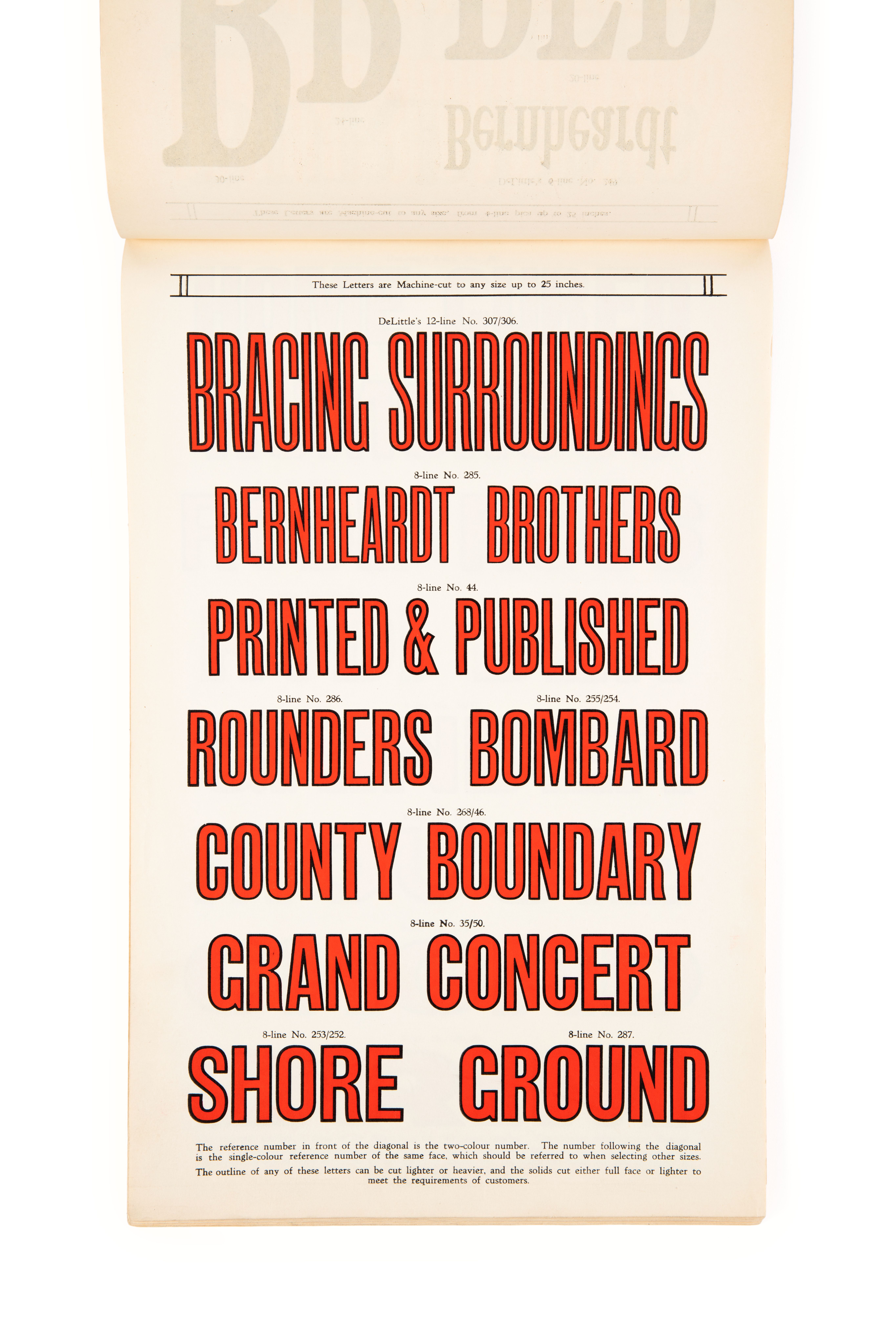 Page from a book showing large red lettering with black outlines.