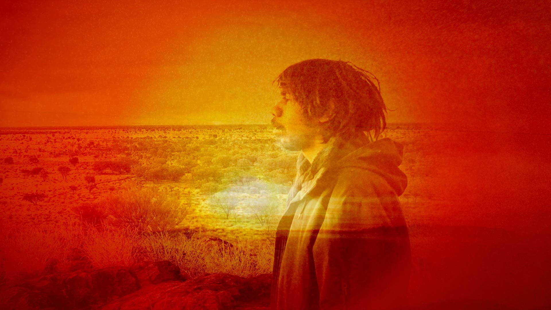 Photo bashed motion image with bright orange sunsets and natural textures over a silhouette of musician Keanu Nelson.