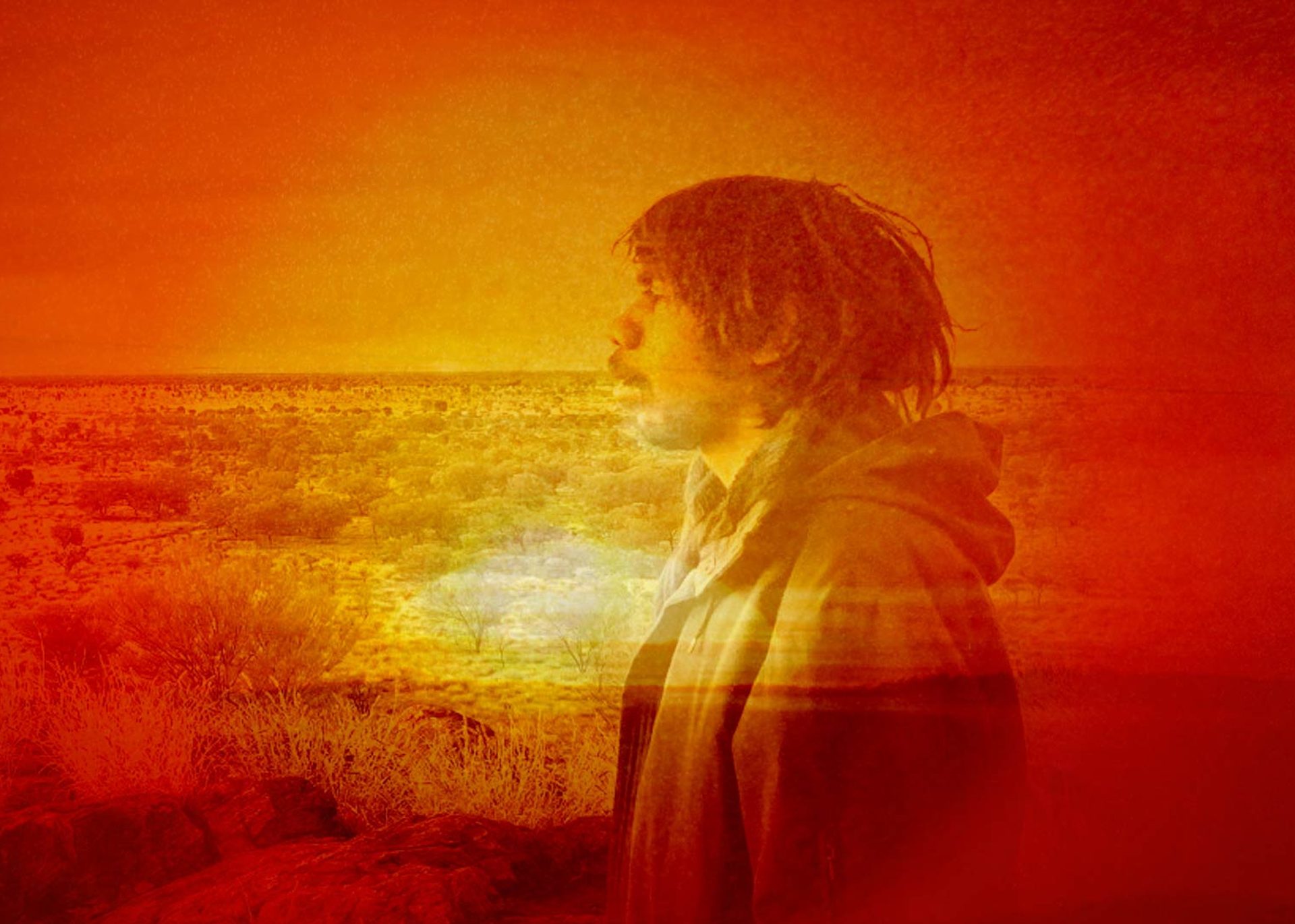 Photo bashed motion image with bright orange sunsets and natural textures over a silhouette of musician Keanu Nelson.