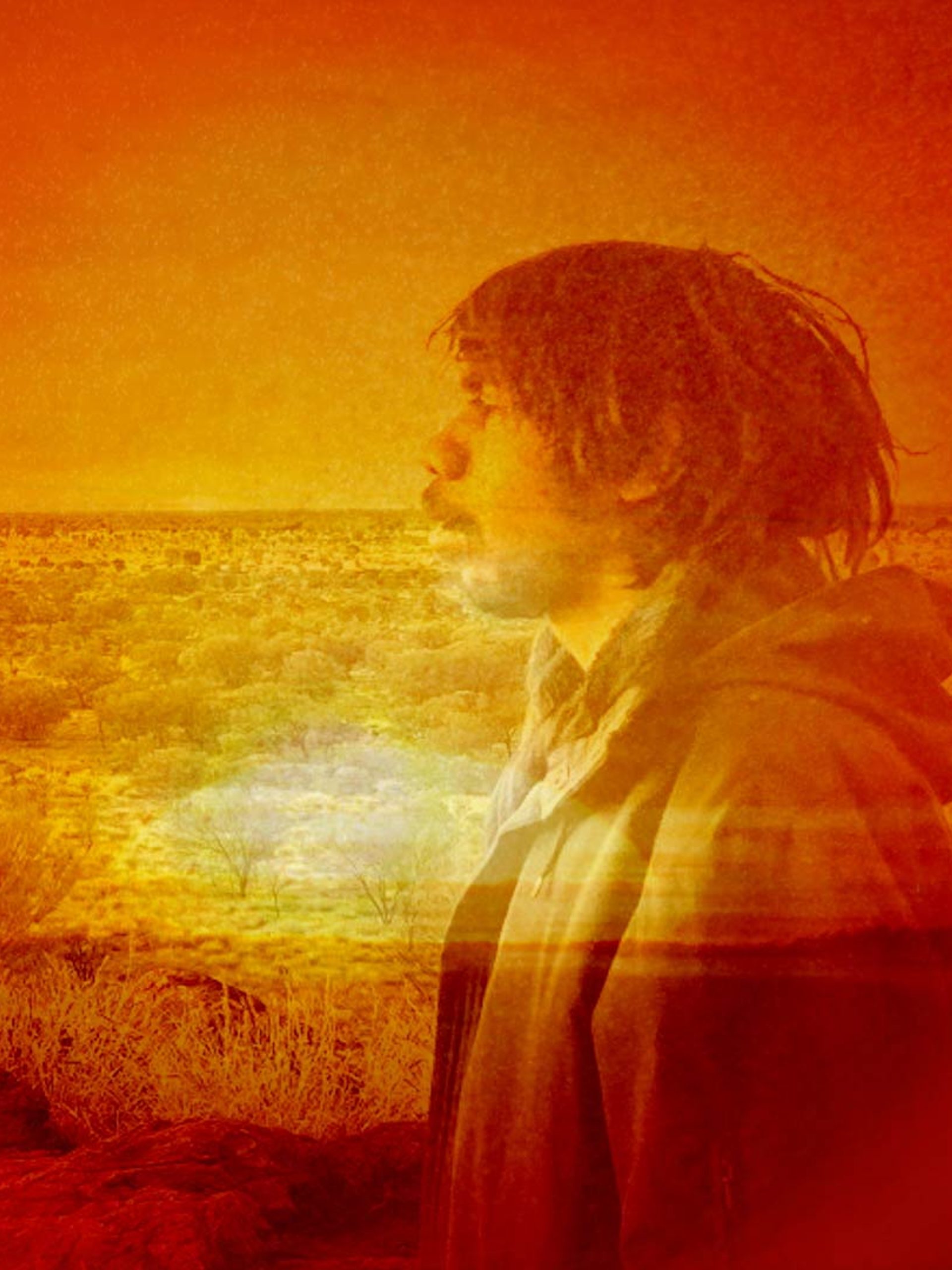 Photo bashed motion image with bright orange sunsets and natural textures over a silhouette of musician Keanu Nelson.