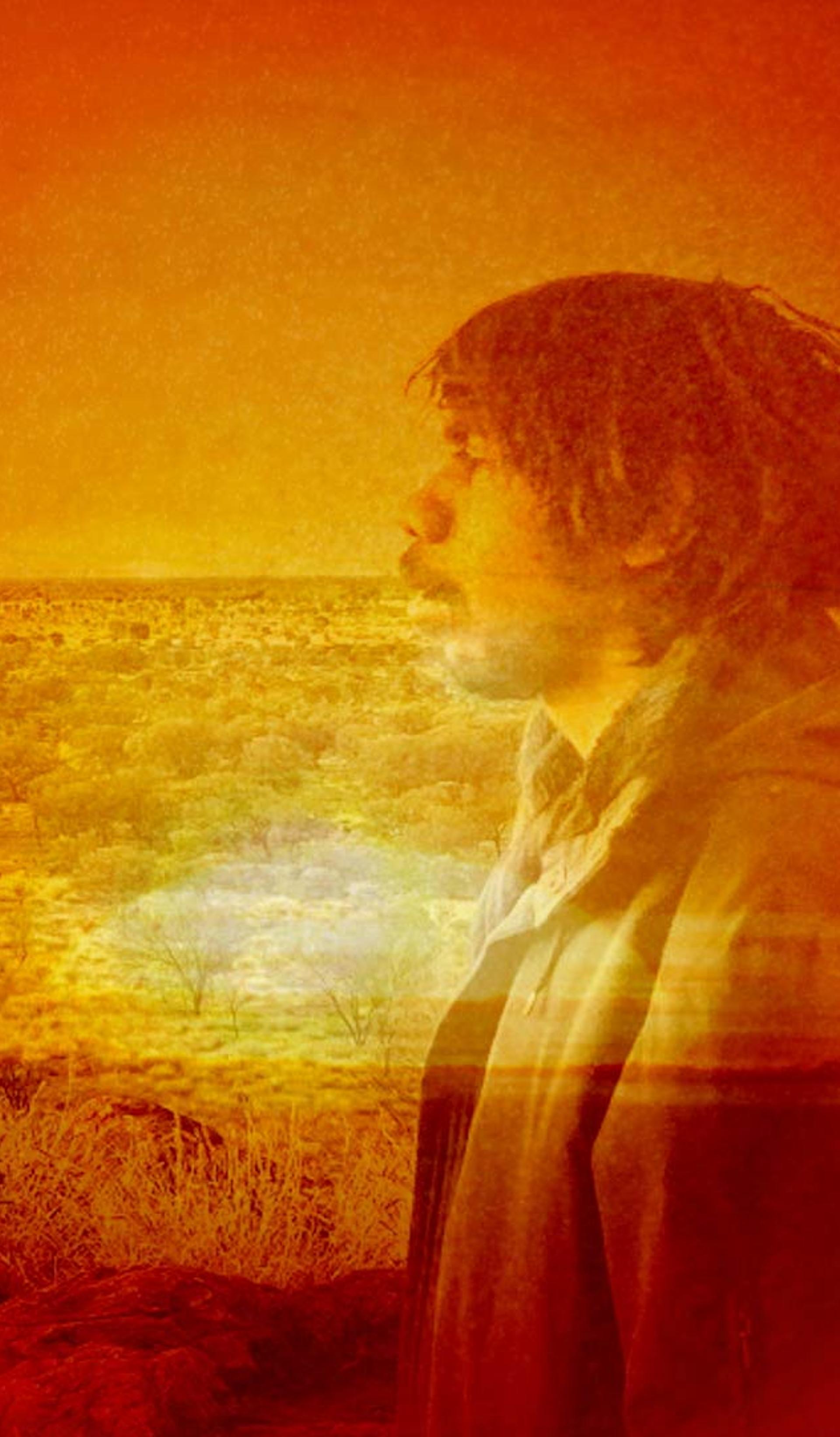 Photo bashed motion image with bright orange sunsets and natural textures over a silhouette of musician Keanu Nelson.