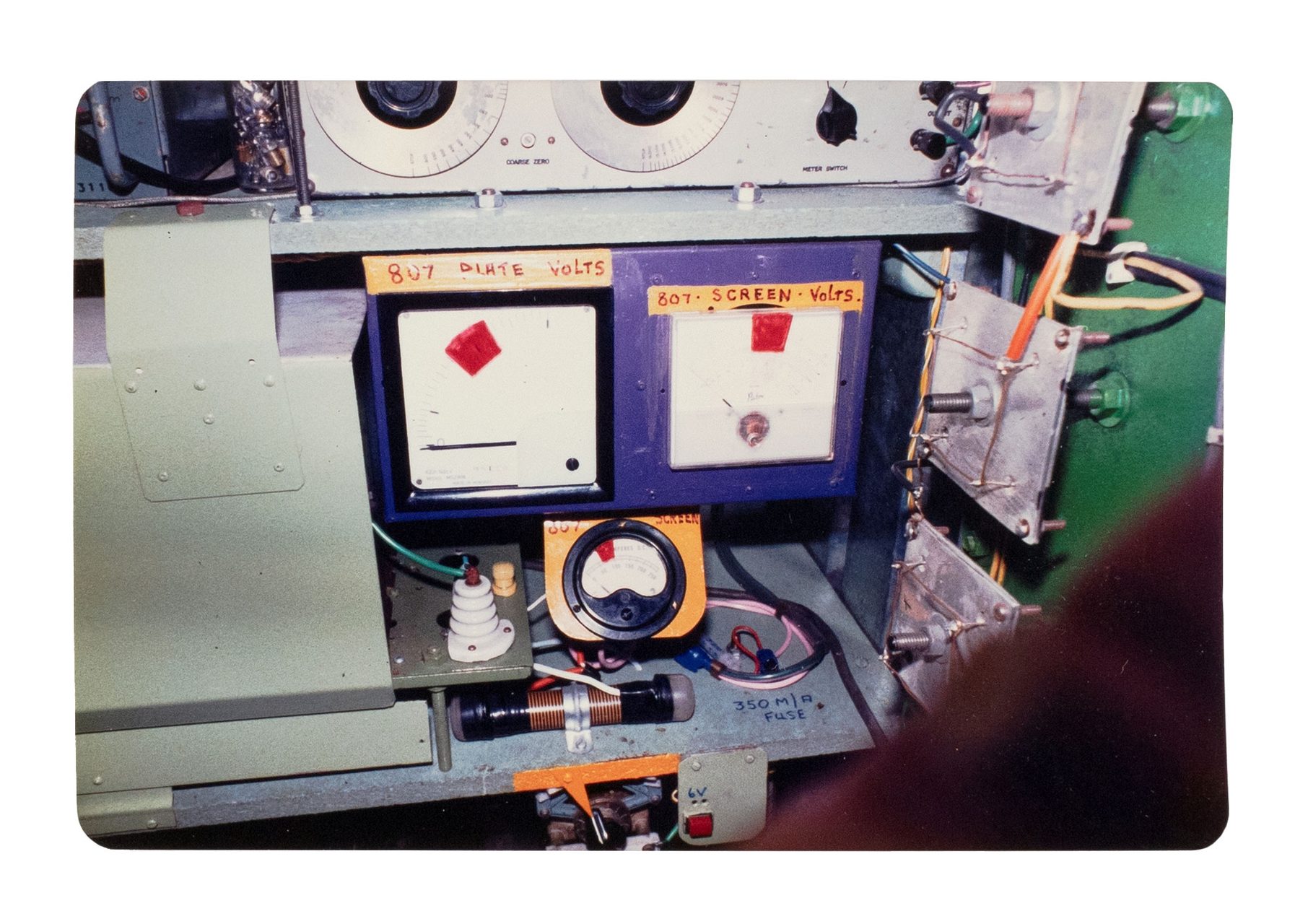 Green and yellow metal 'garden' shed containing elaborate electronic systems built into the interior. Inside the shed is a compartment which contains a seat where the user can sit and be suffused with radio waves produced by the electronic system.