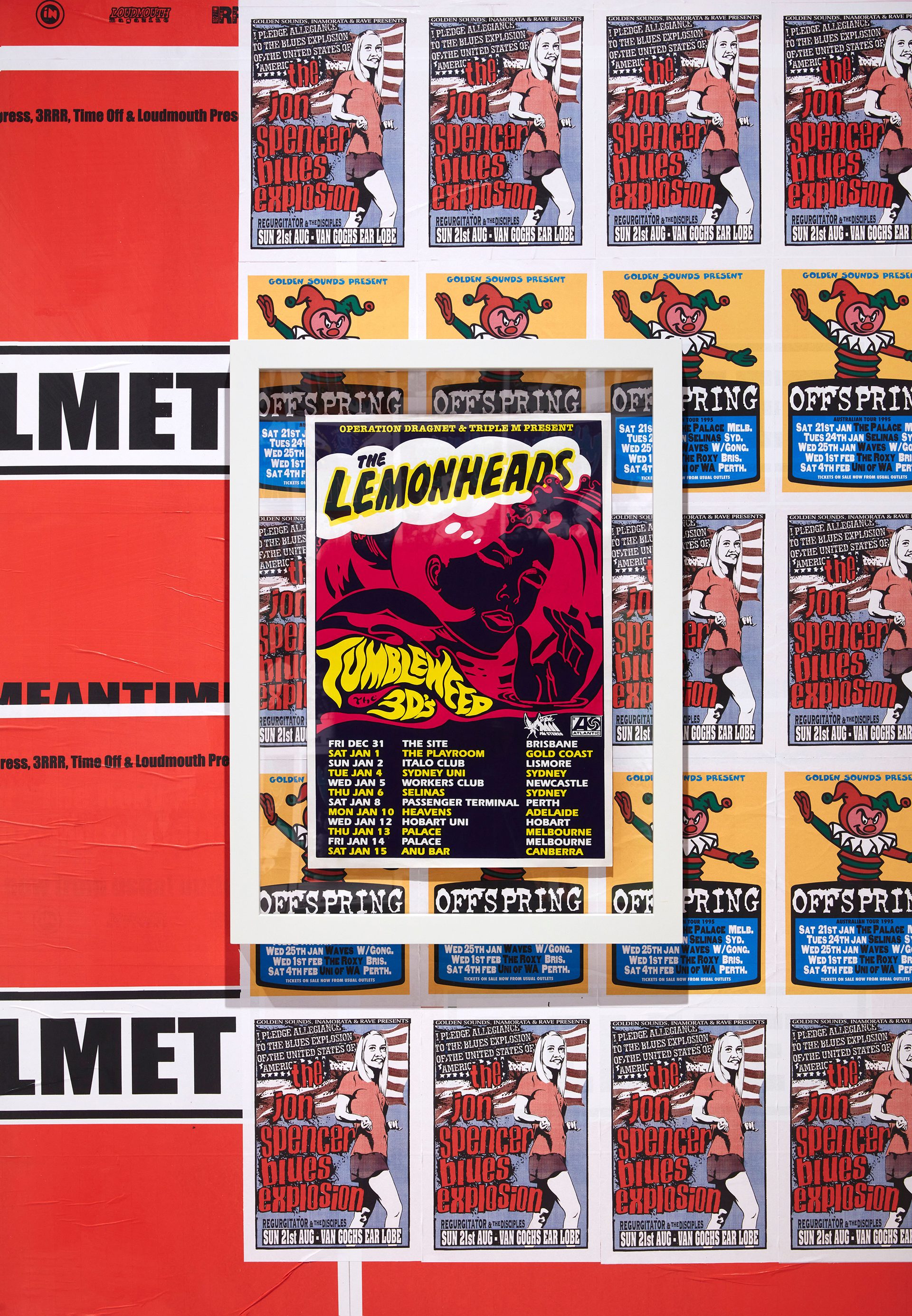 A wall covered in band posters including Offspring, Lemonheads and The Jon Spencer Blues Explosion.