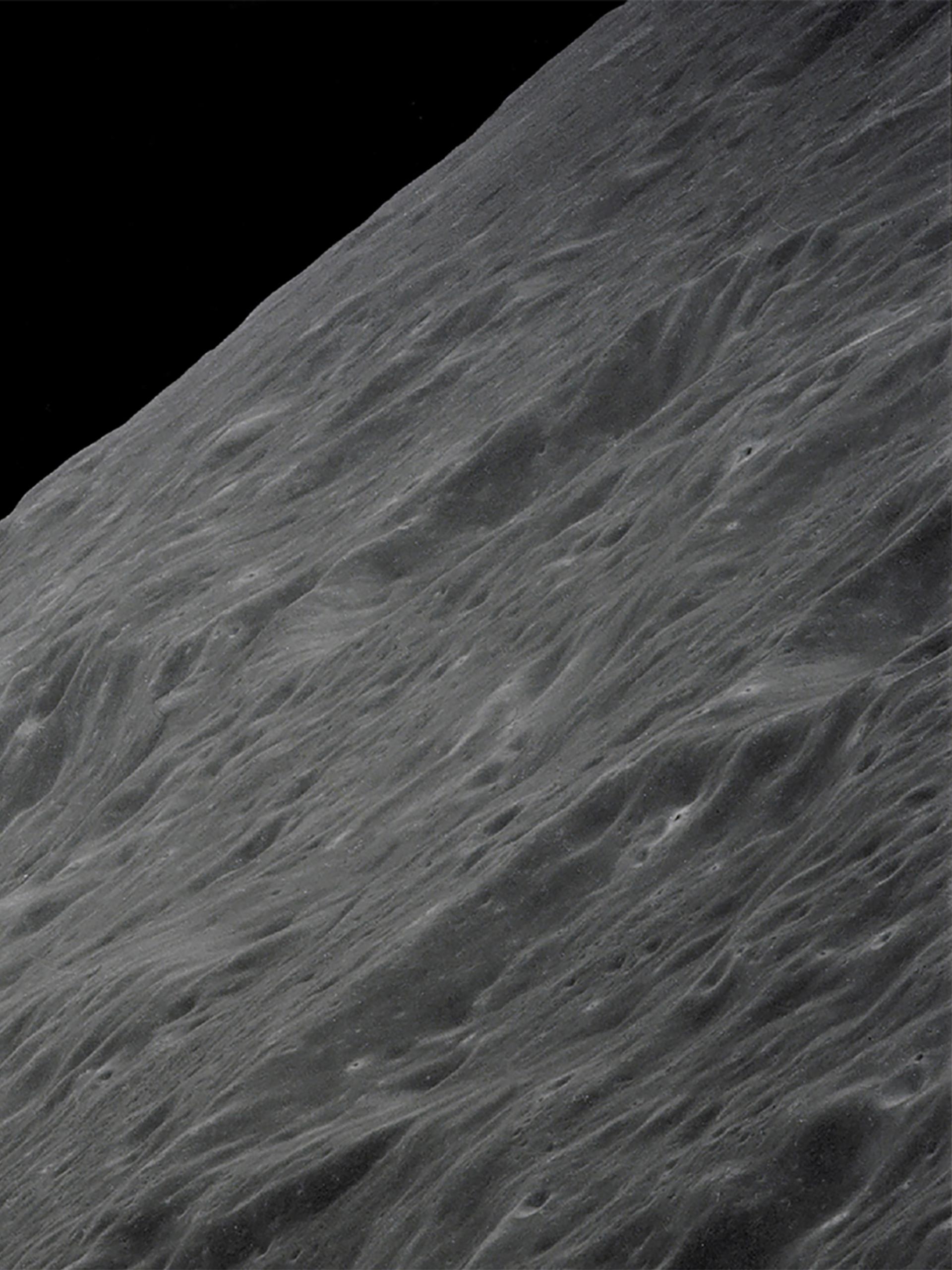 Image of Earth rising above the Moon's horizon.