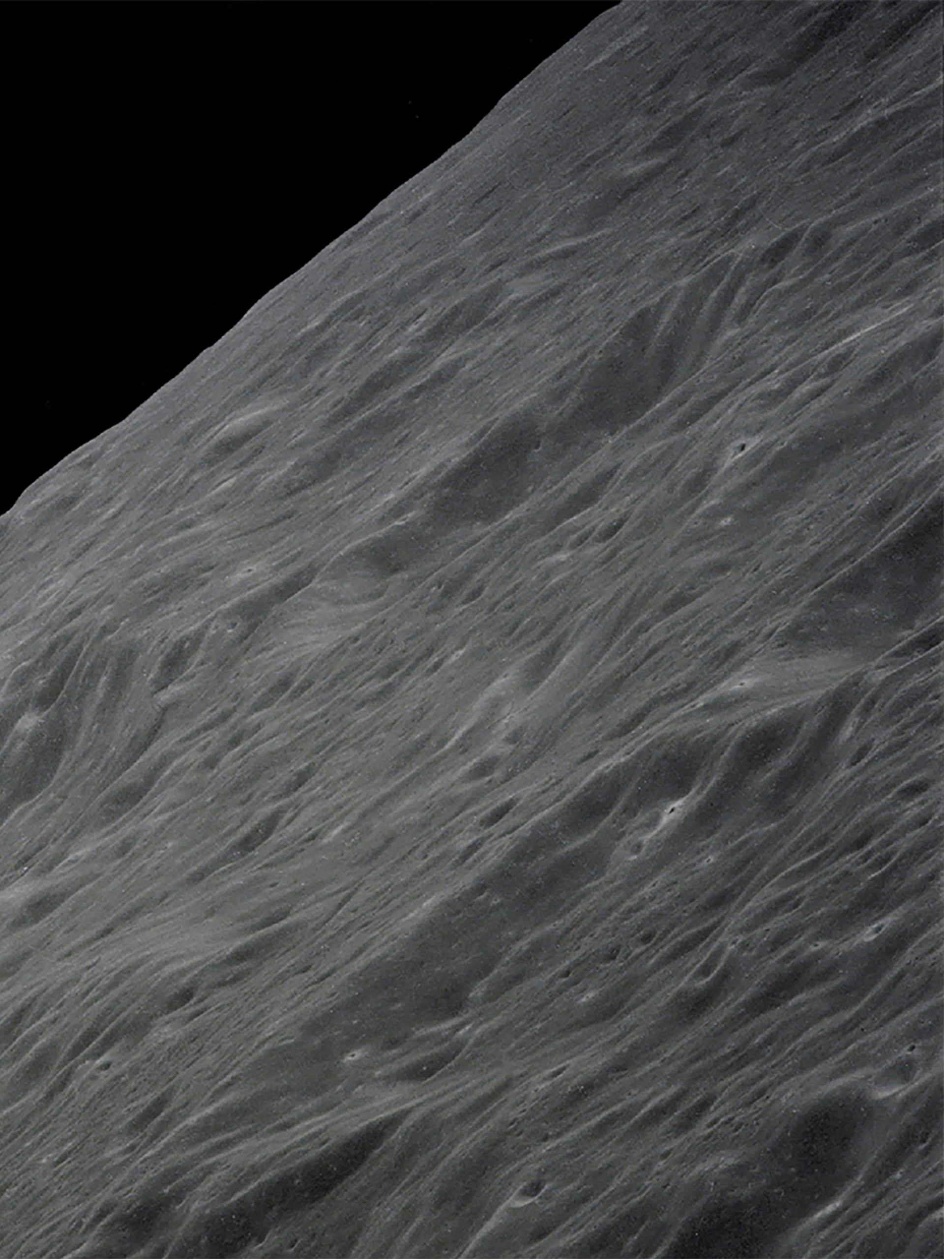 Image of Earth rising above the Moon's horizon.