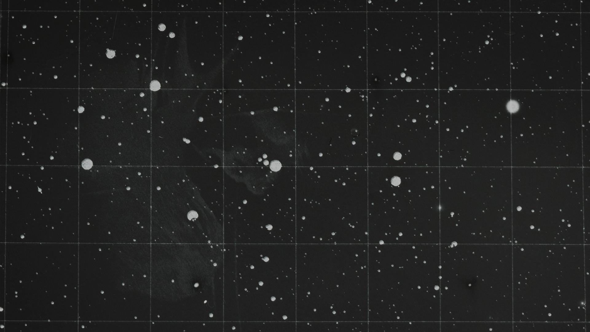 Photograph of a glass plate slide used for teaching astronomy depicting the Pleiades, a star cluster.