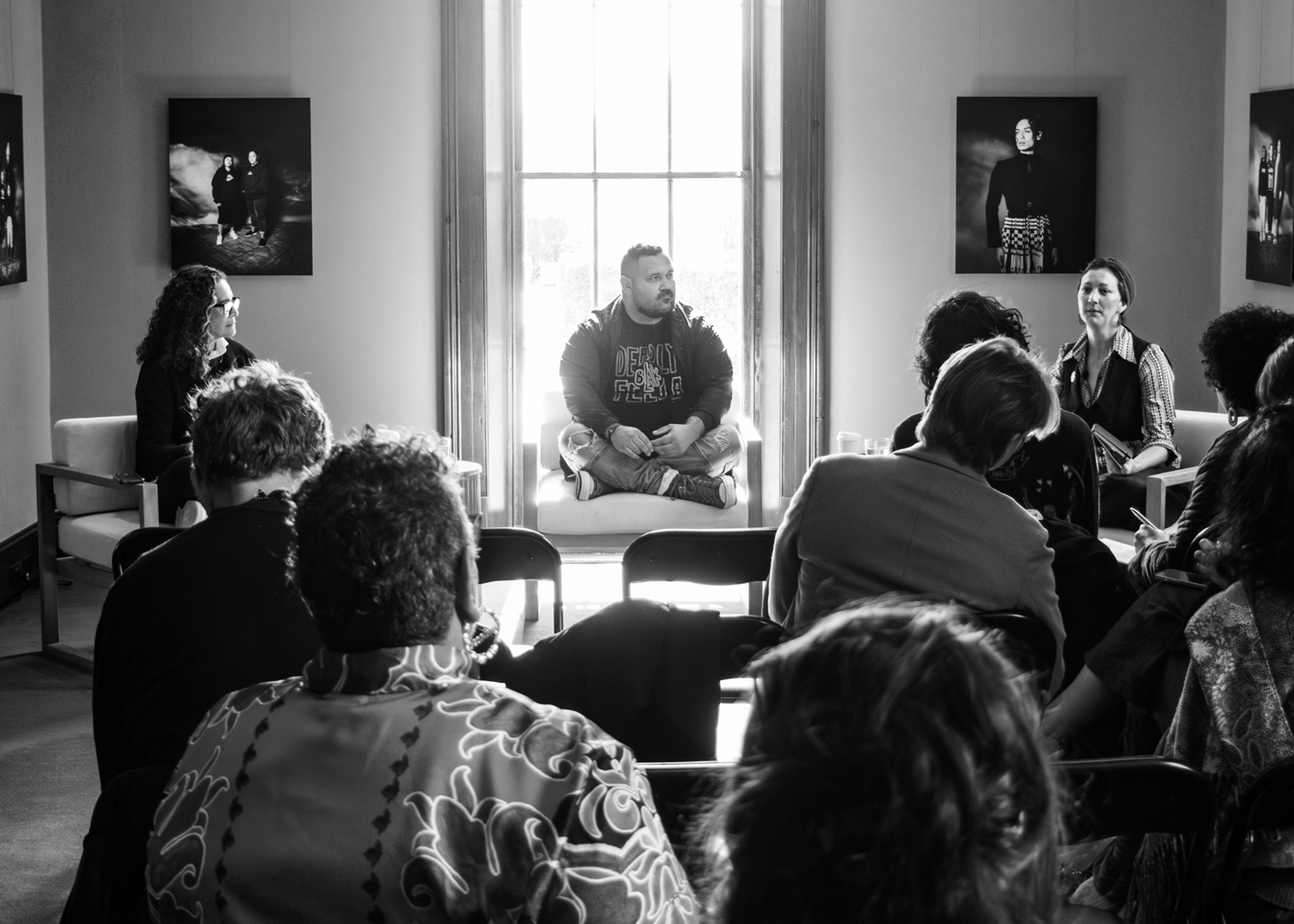 A Fijian woman, Gooniyandi Gajerrong man, and a Koori Goori and Lebanese woman sit together, in conversation in front of an audience.