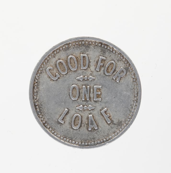 A round silver trade token with inscription: ‘GOOD FOR ONE LOAF’