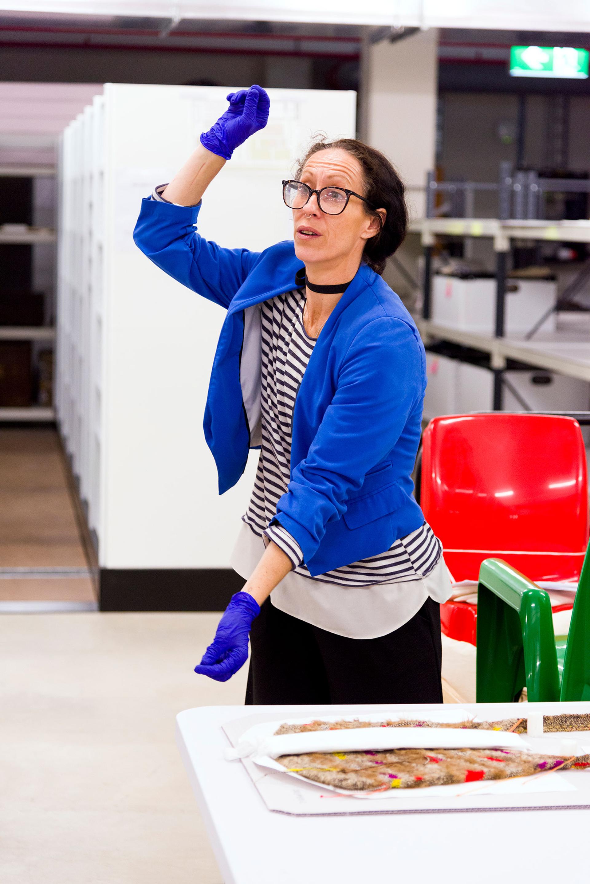 Image facilitator in museum store demonstrating to students