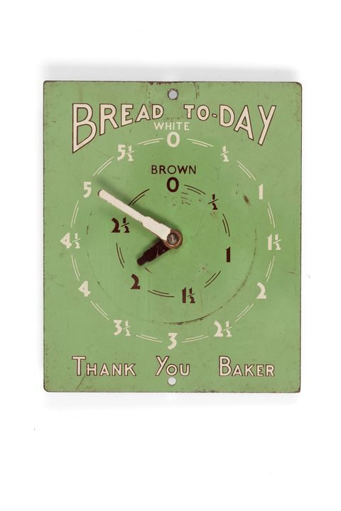 Bread order indicator, 'Bread Today', domestic, board with 2 indicator 'arms' and 2 circular dials showing number of loaves required, white or brown, sheet metal, green enamelled.