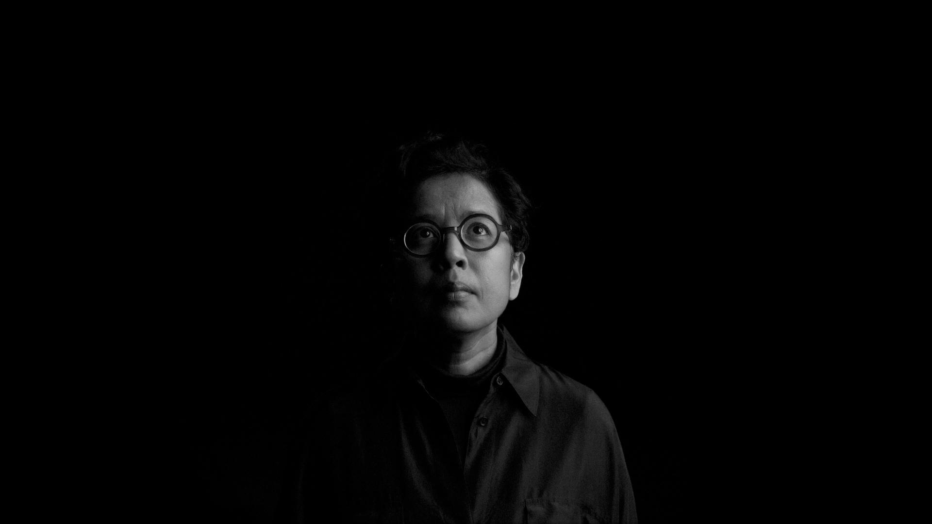 Half lit face in the dark.