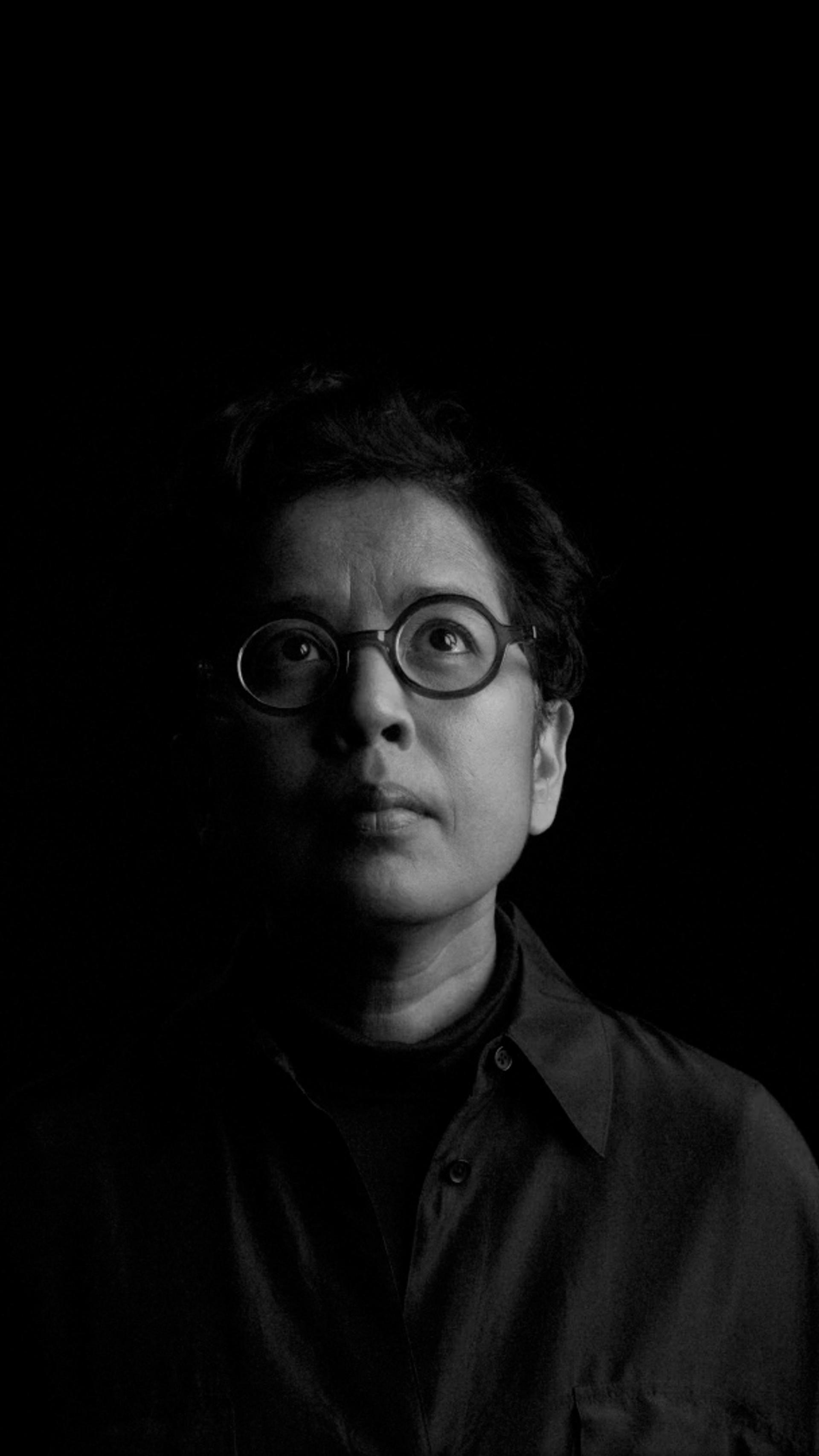 Half lit face in the dark.
