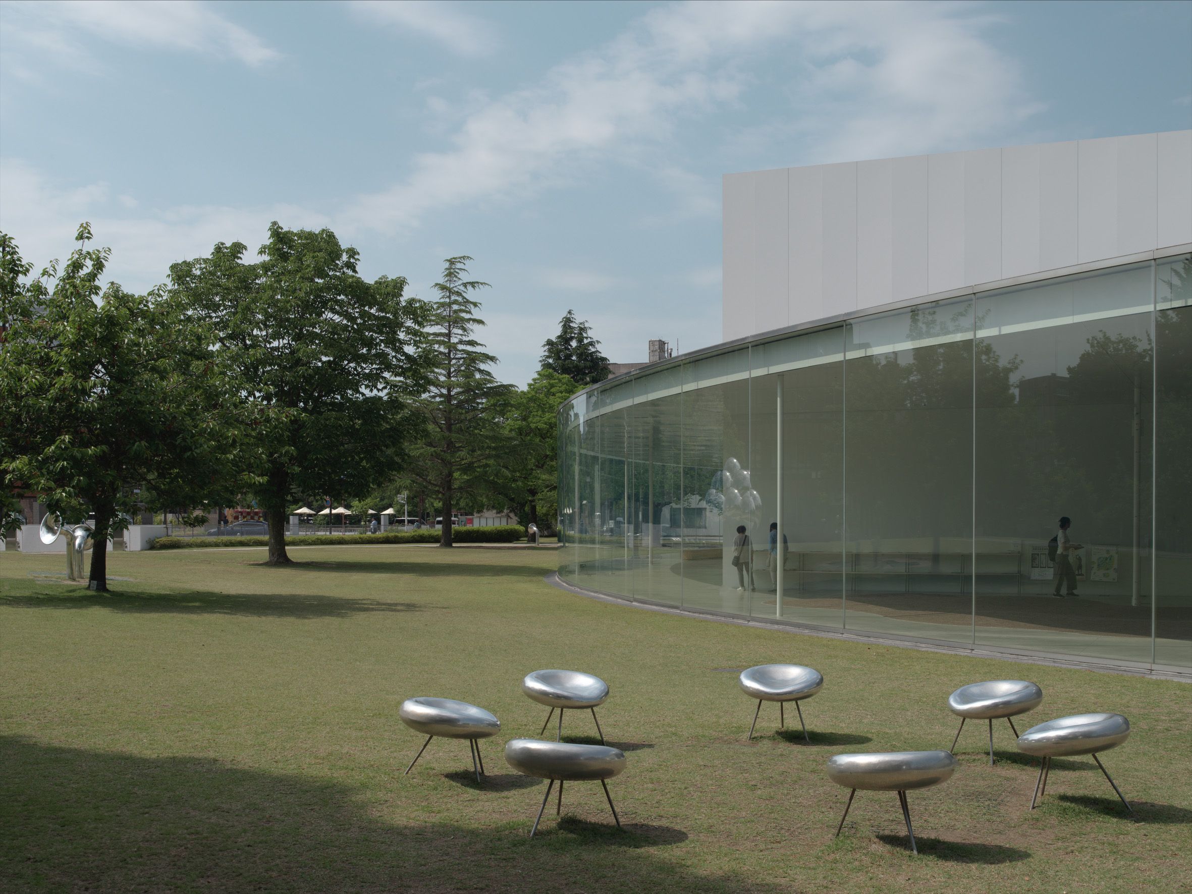 A curved wall of glass exterior of a building.