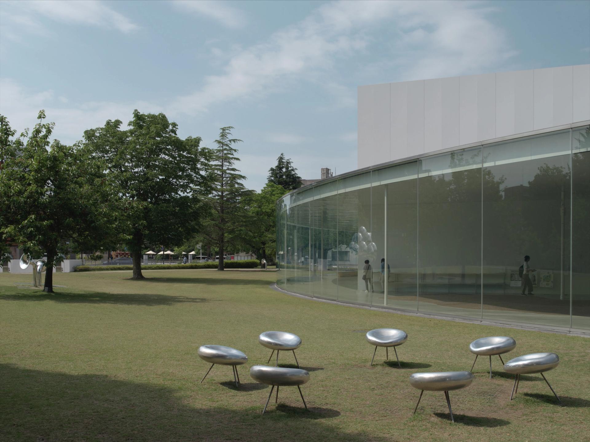 A curved wall of glass exterior of a building.