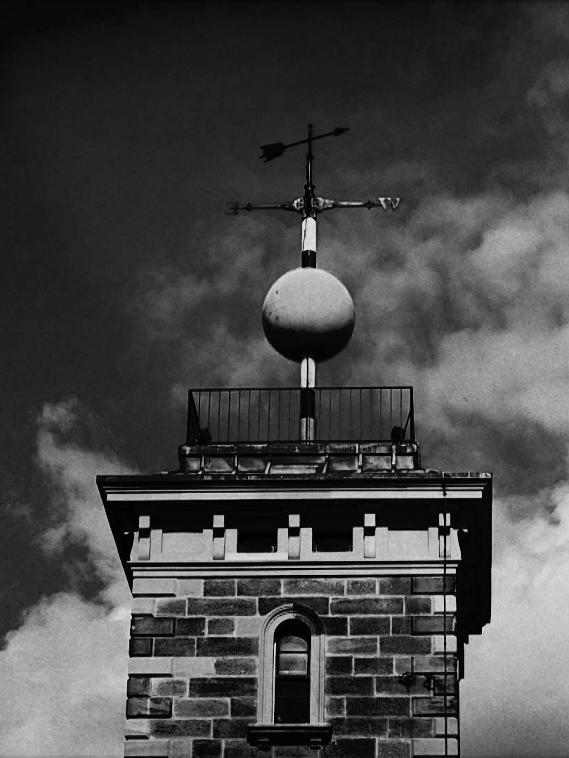 A weather pane above a building.