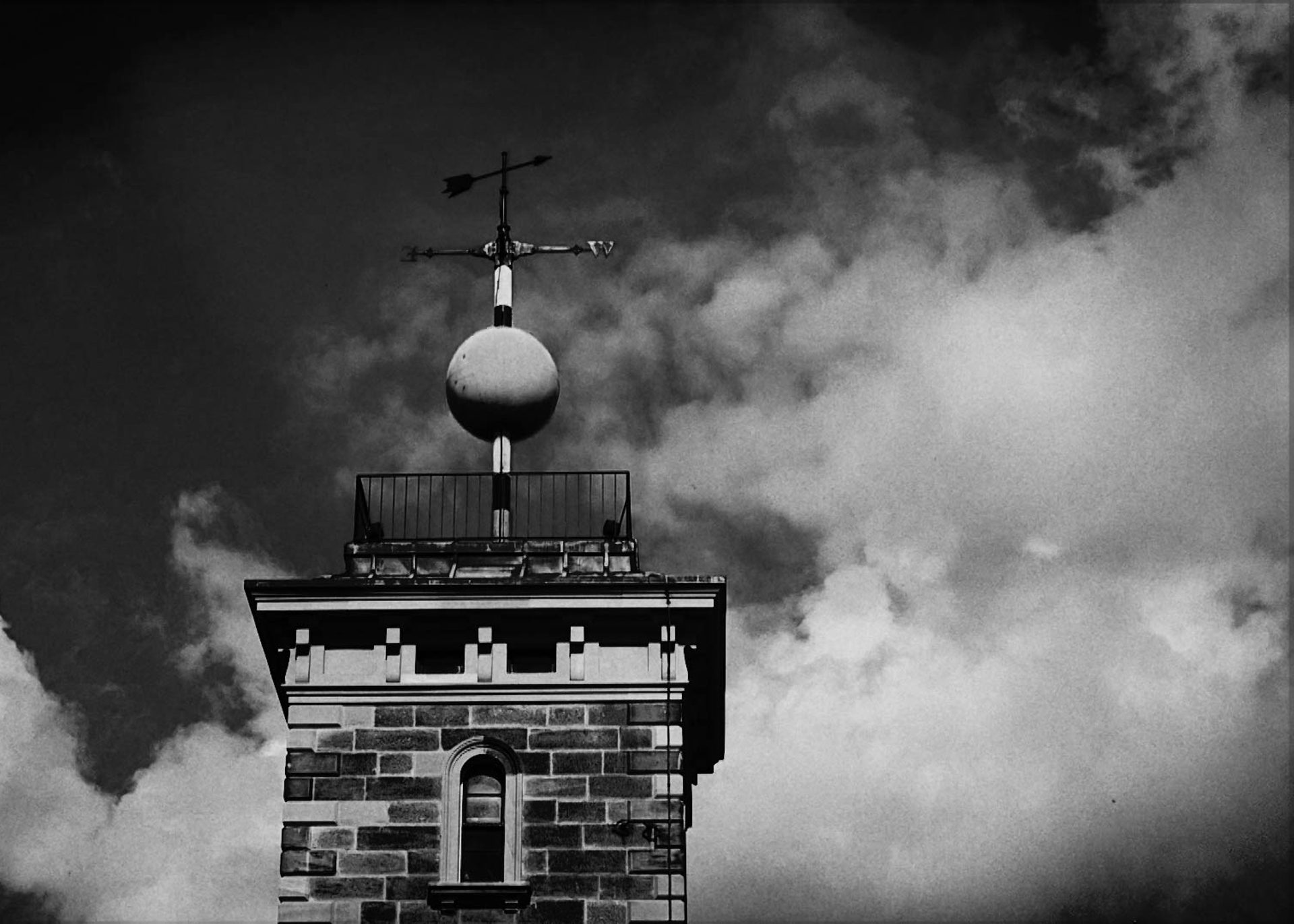 A weather pane above a building.
