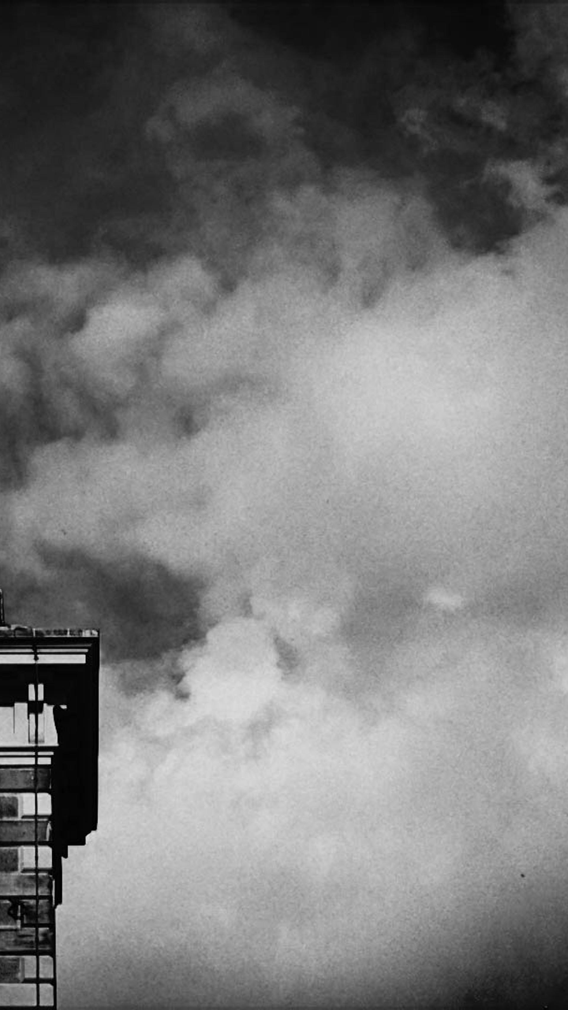 A weather pane above a building.