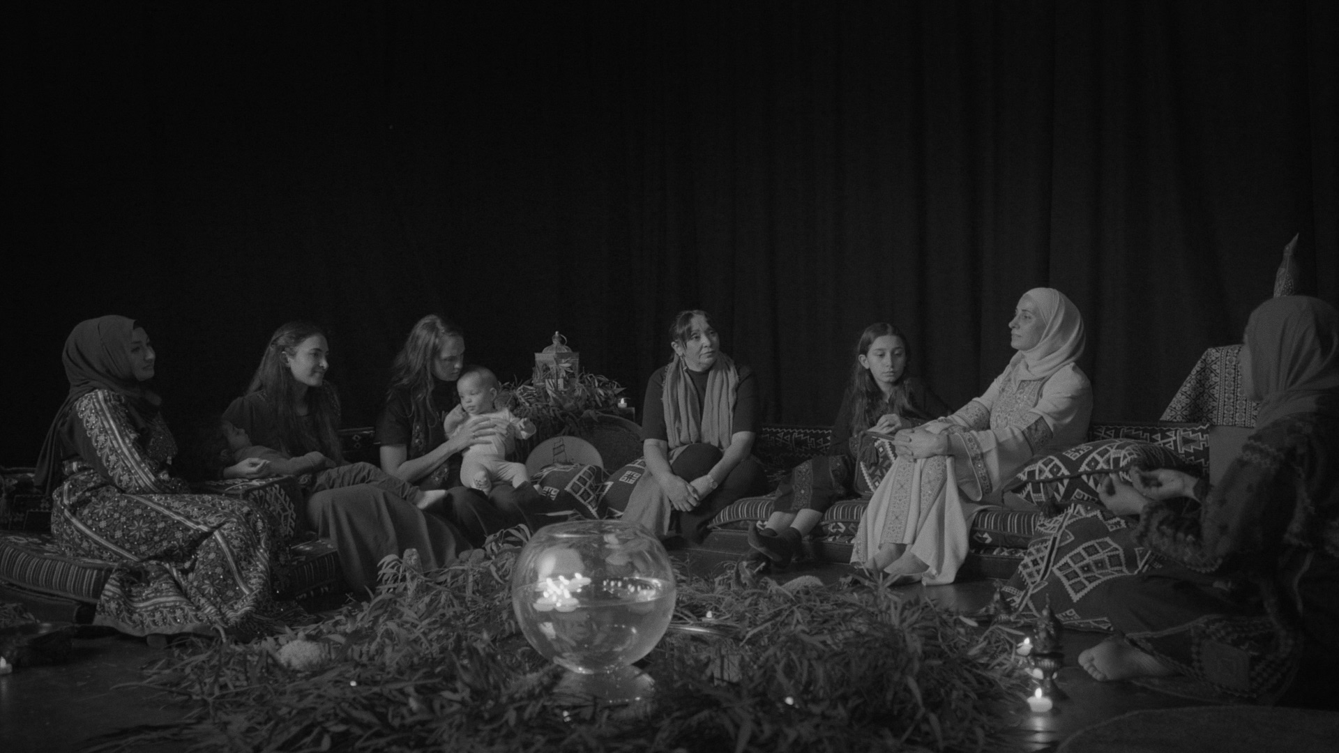 A group of Palestinian and First Nations women in a talking circle.