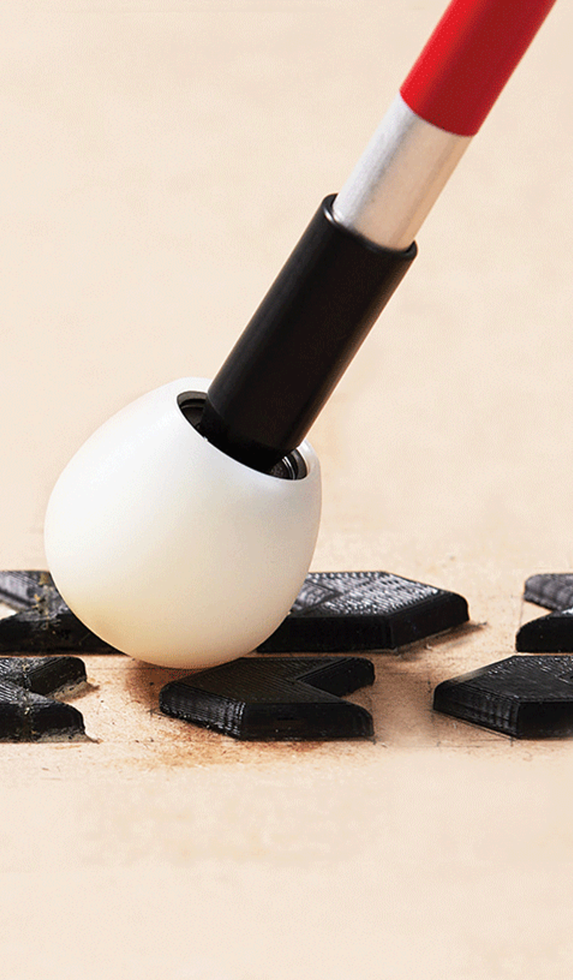 Image of black tactile ground surface indicators designed by Genevieve Bryant for the blind.