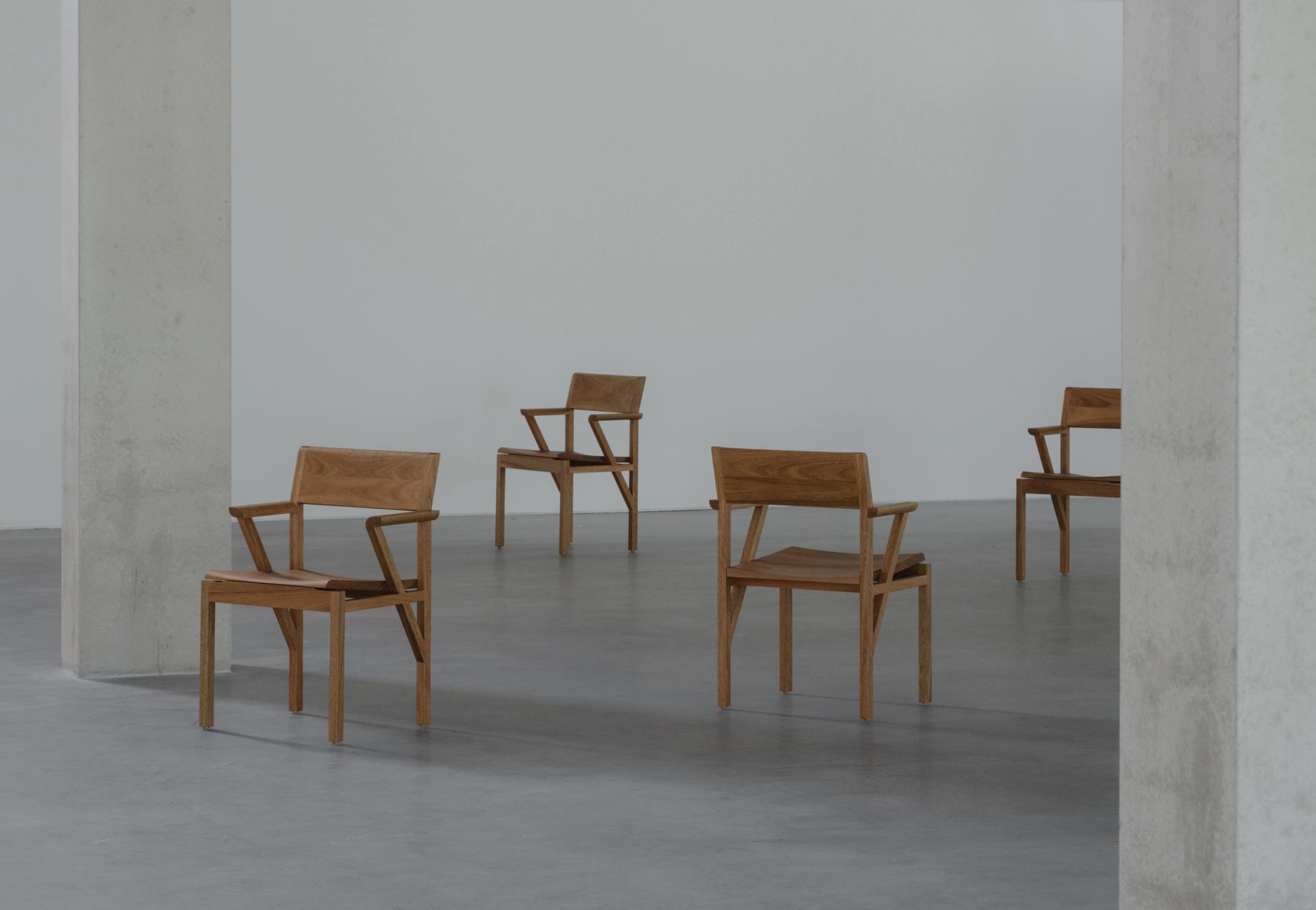Chairs sitting in a format within a big open room.