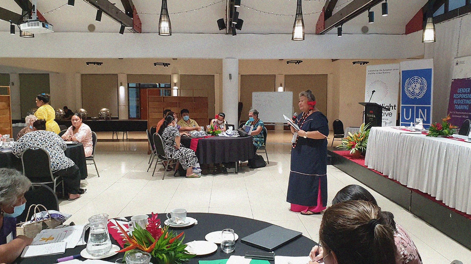 Conference with Sāmoan women sitting around large round tables