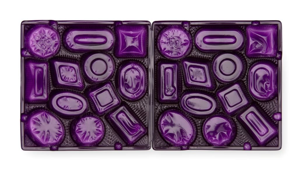Purple coloured plastic trays with many shapes.